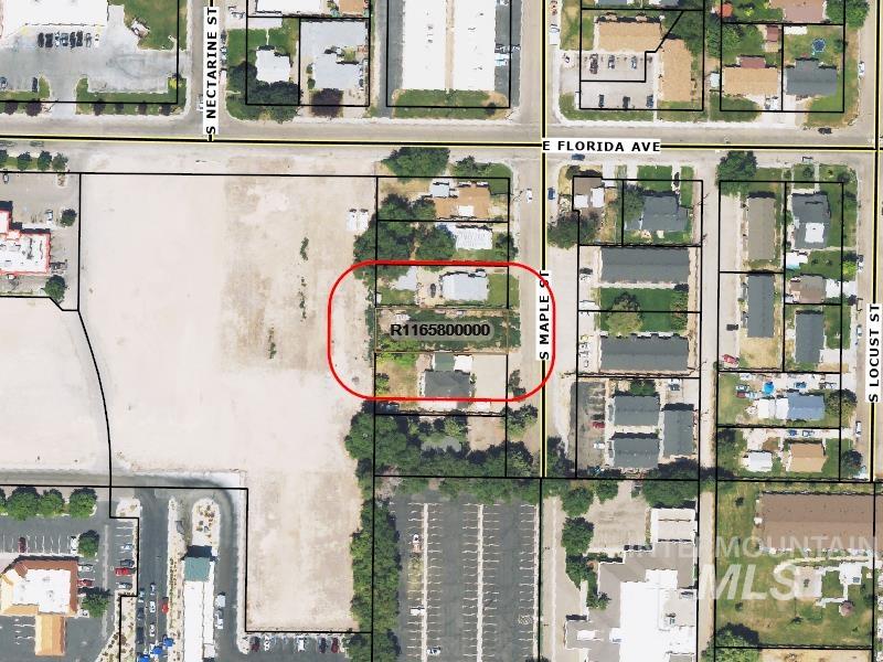 Aerial map of property and surrounding area featuring property parcel outlined