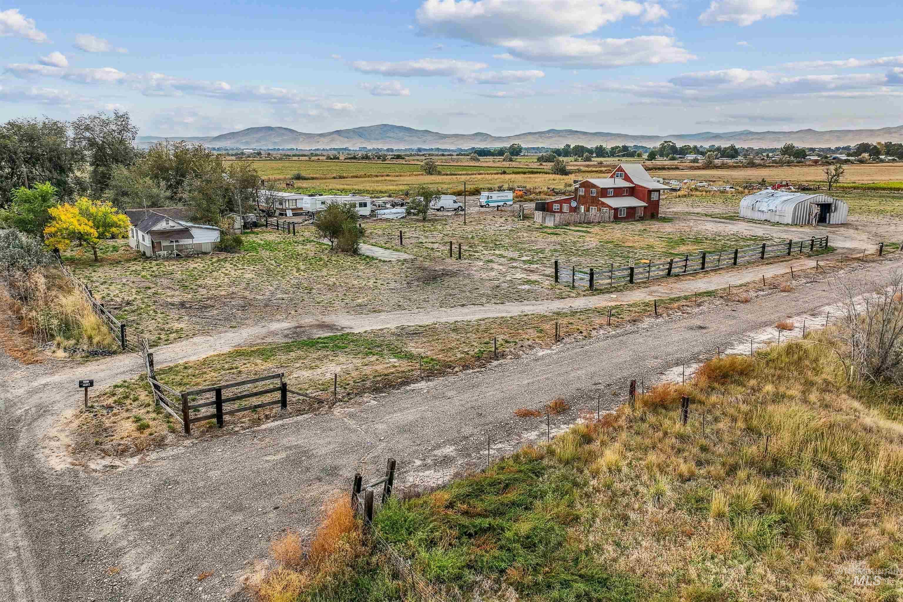 Overview of rural landscape featuring a mountain backdrop