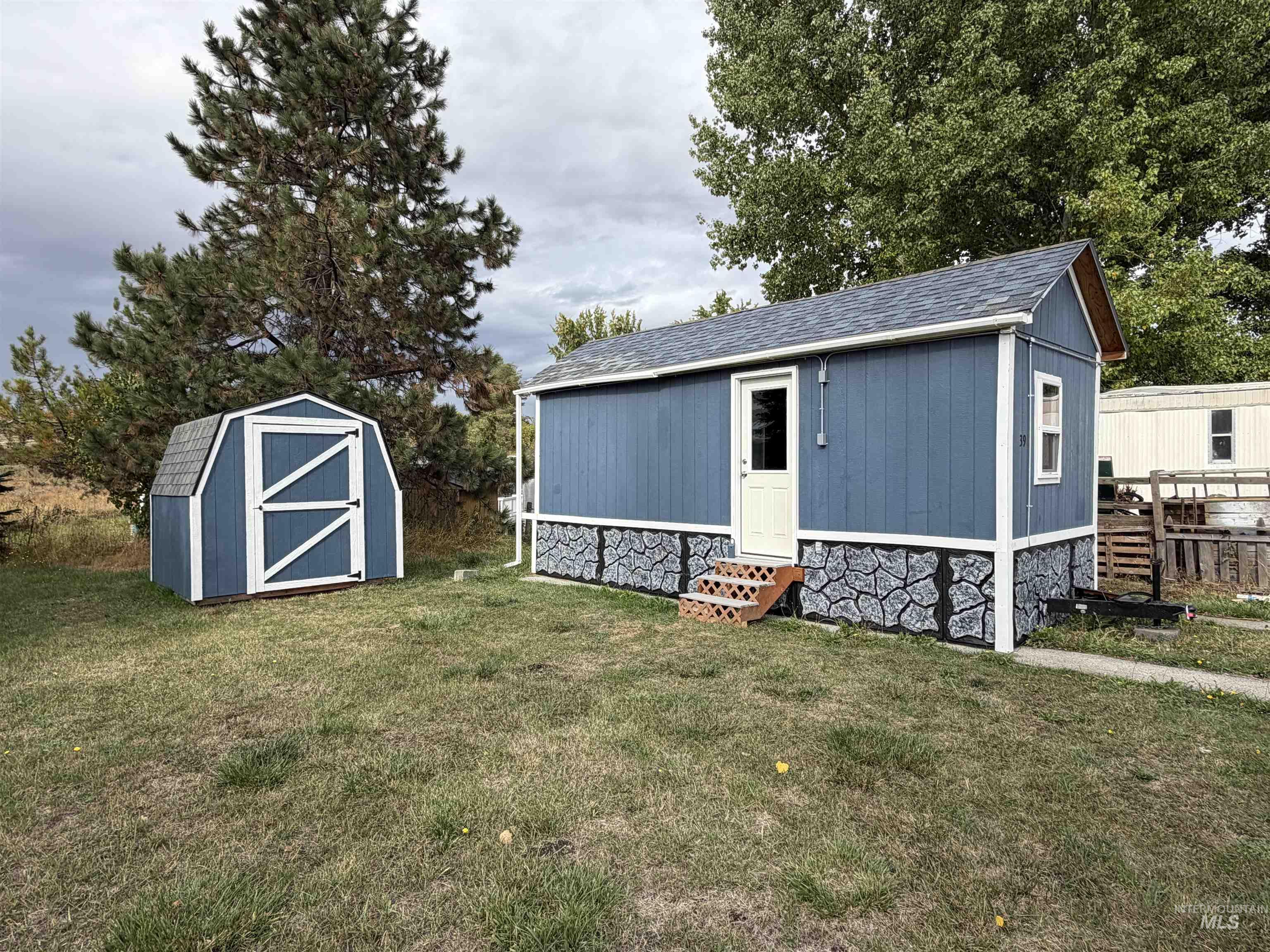 View of shed with entry steps