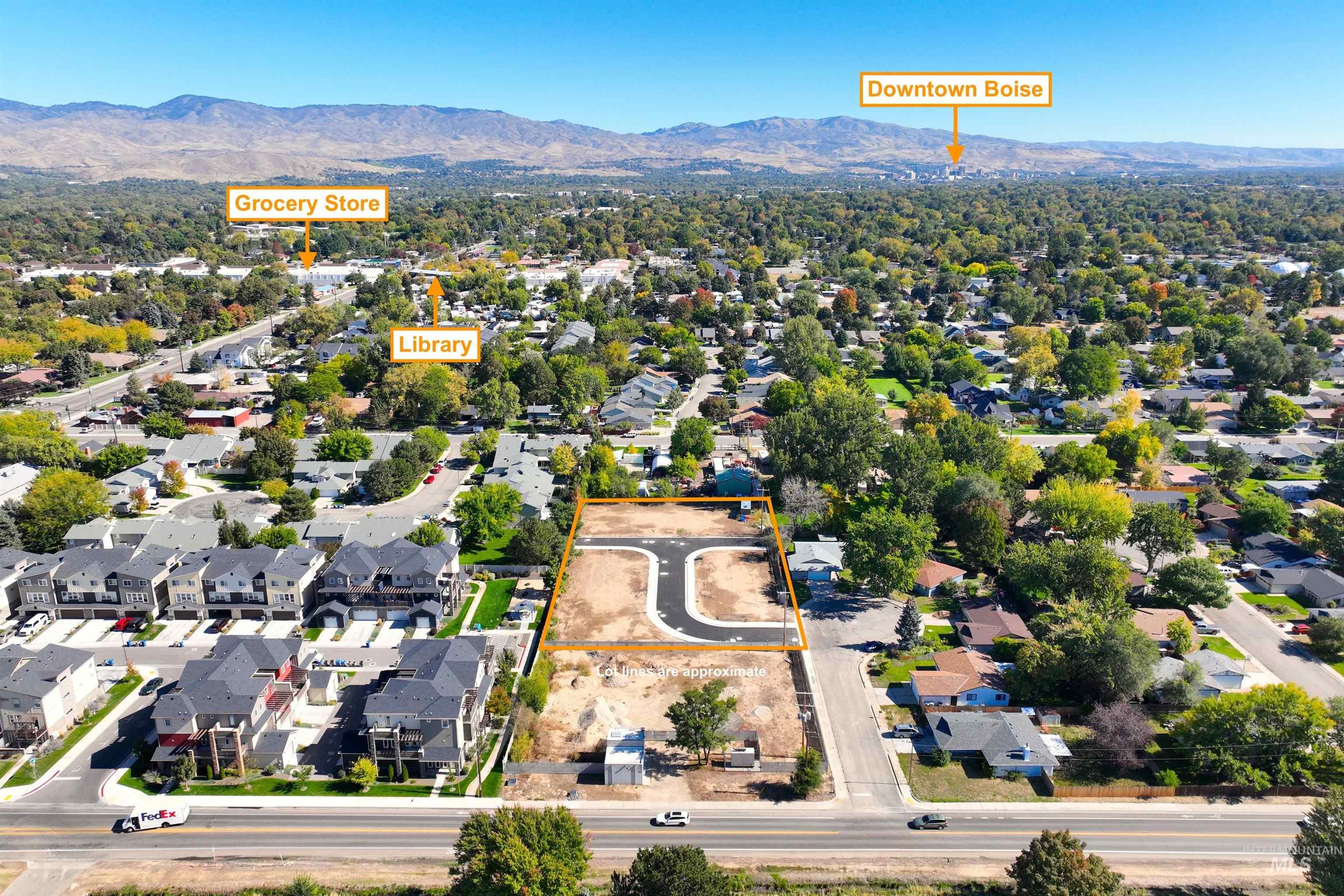 Aerial perspective of suburban area with a mountainous background and property boundaries highlighted