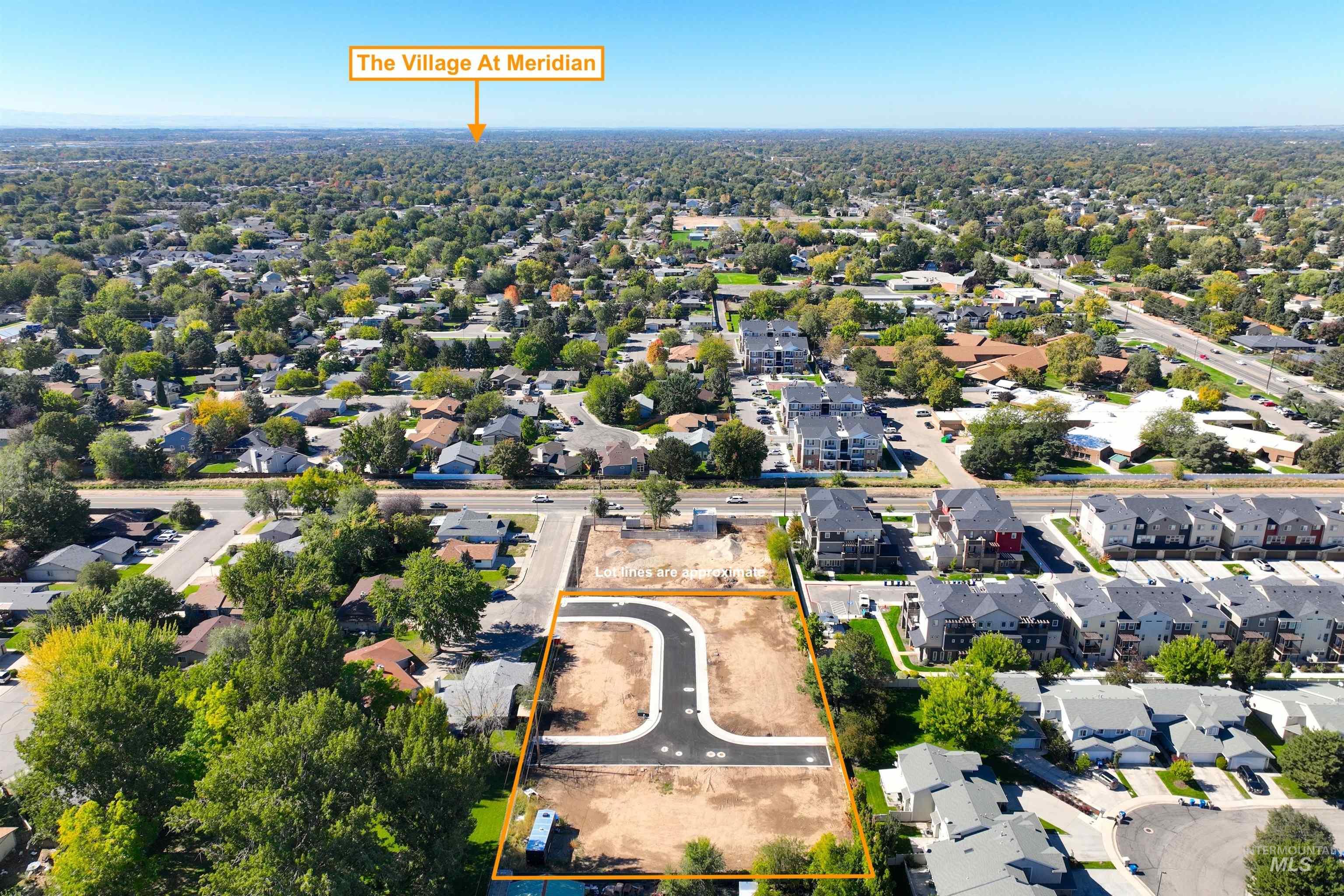 Aerial view of residential area featuring property boundaries highlighted