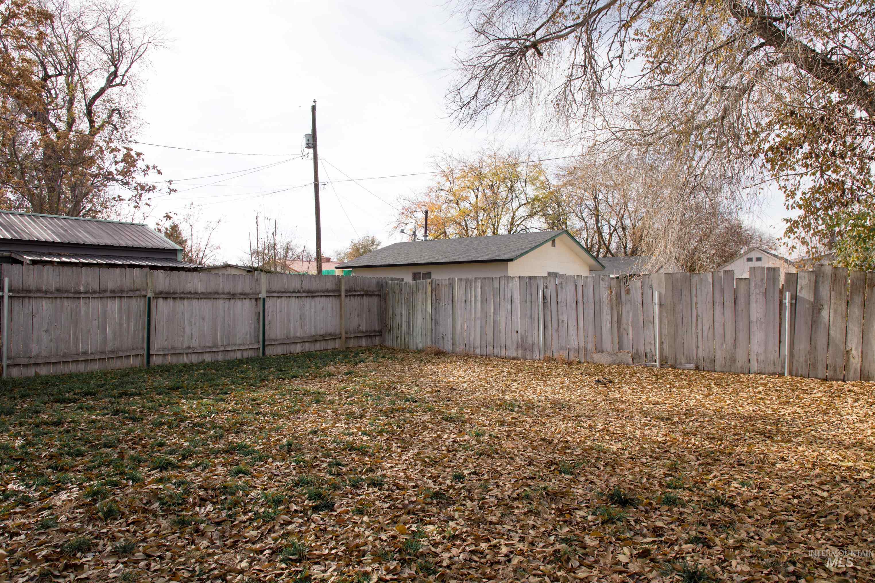 View of fenced backyard