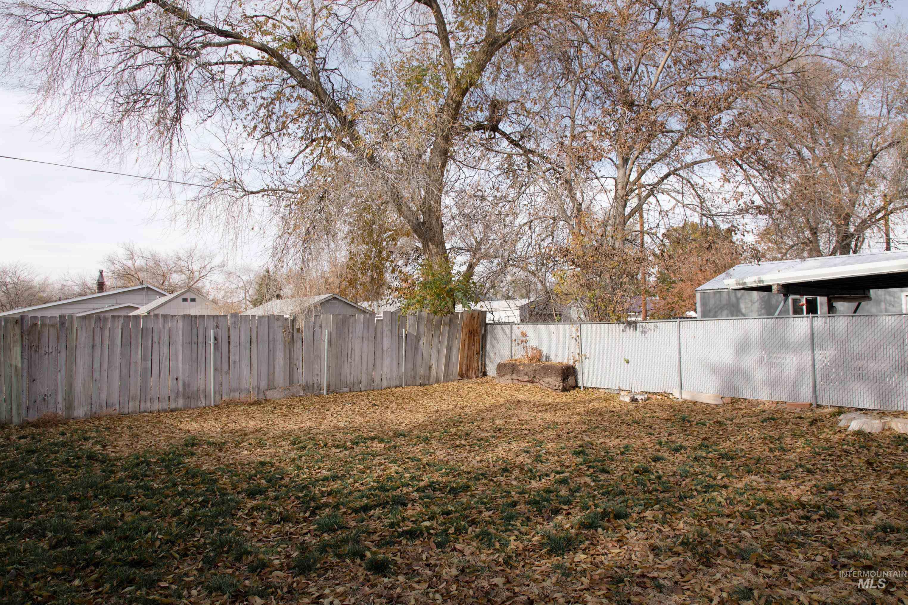 View of fenced backyard