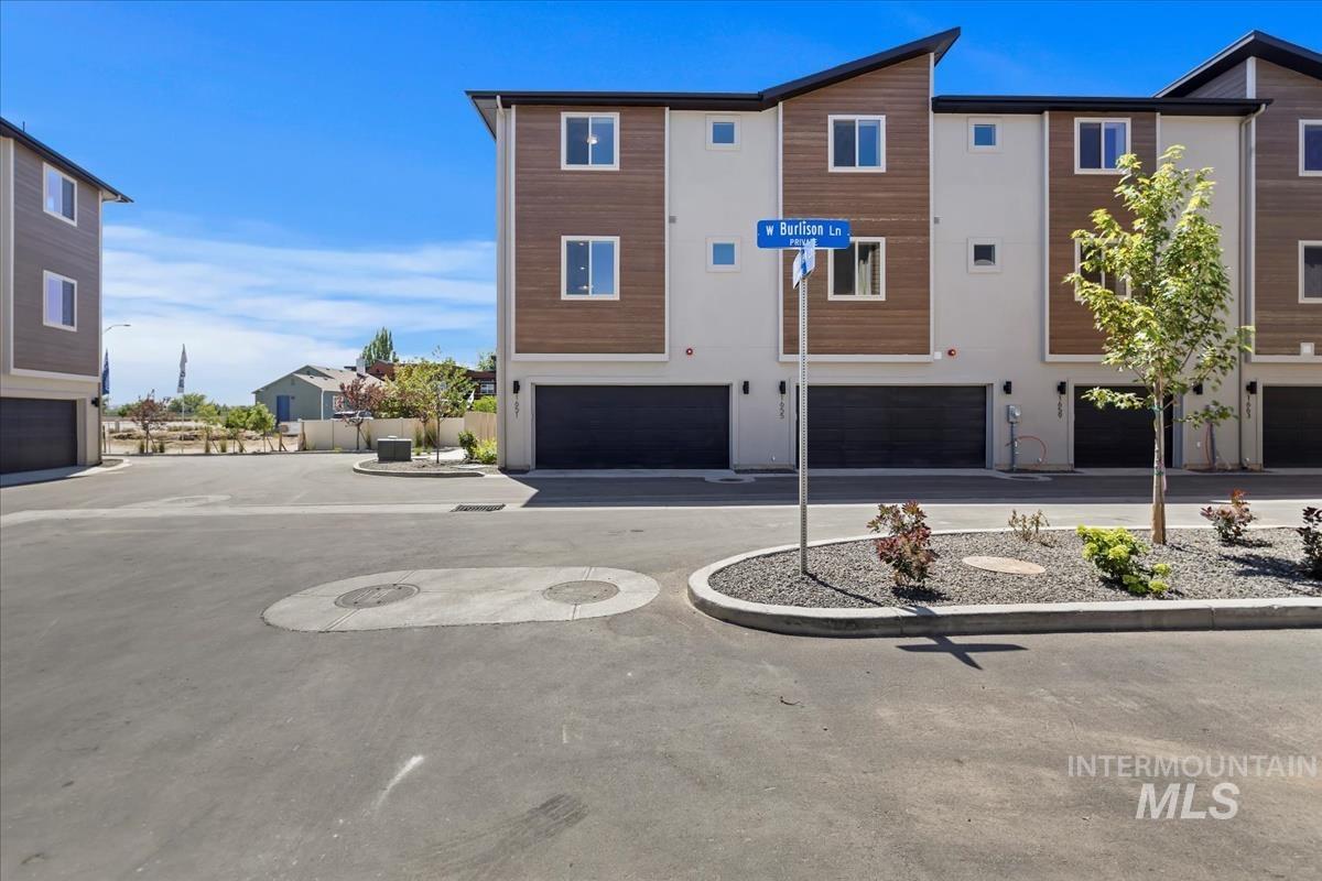 View of front of house featuring a garage and driveway
