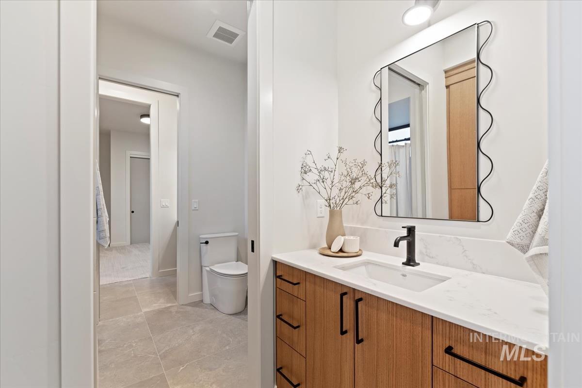 Bathroom with vanity and toilet