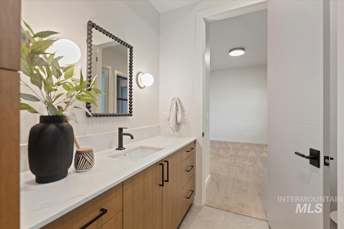 Bathroom featuring vanity and light tile patterned flooring