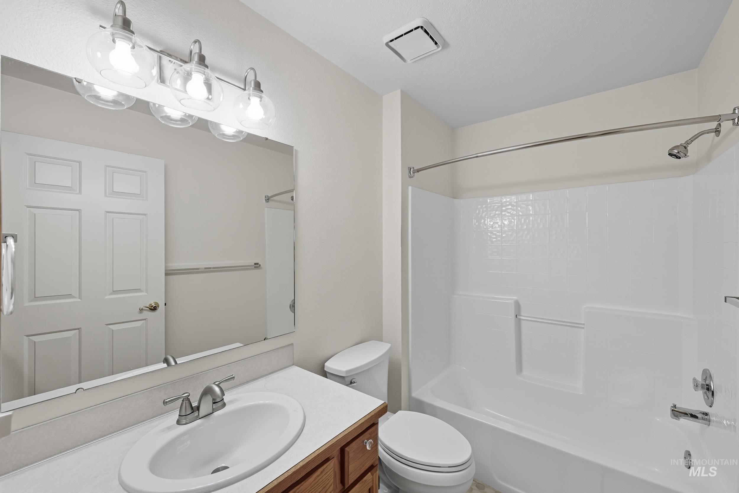 Bathroom featuring bathing tub / shower combination and vanity