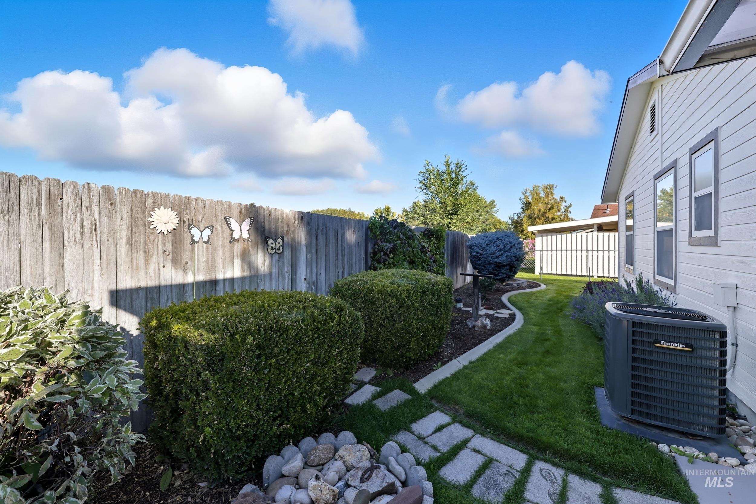 View of fenced backyard