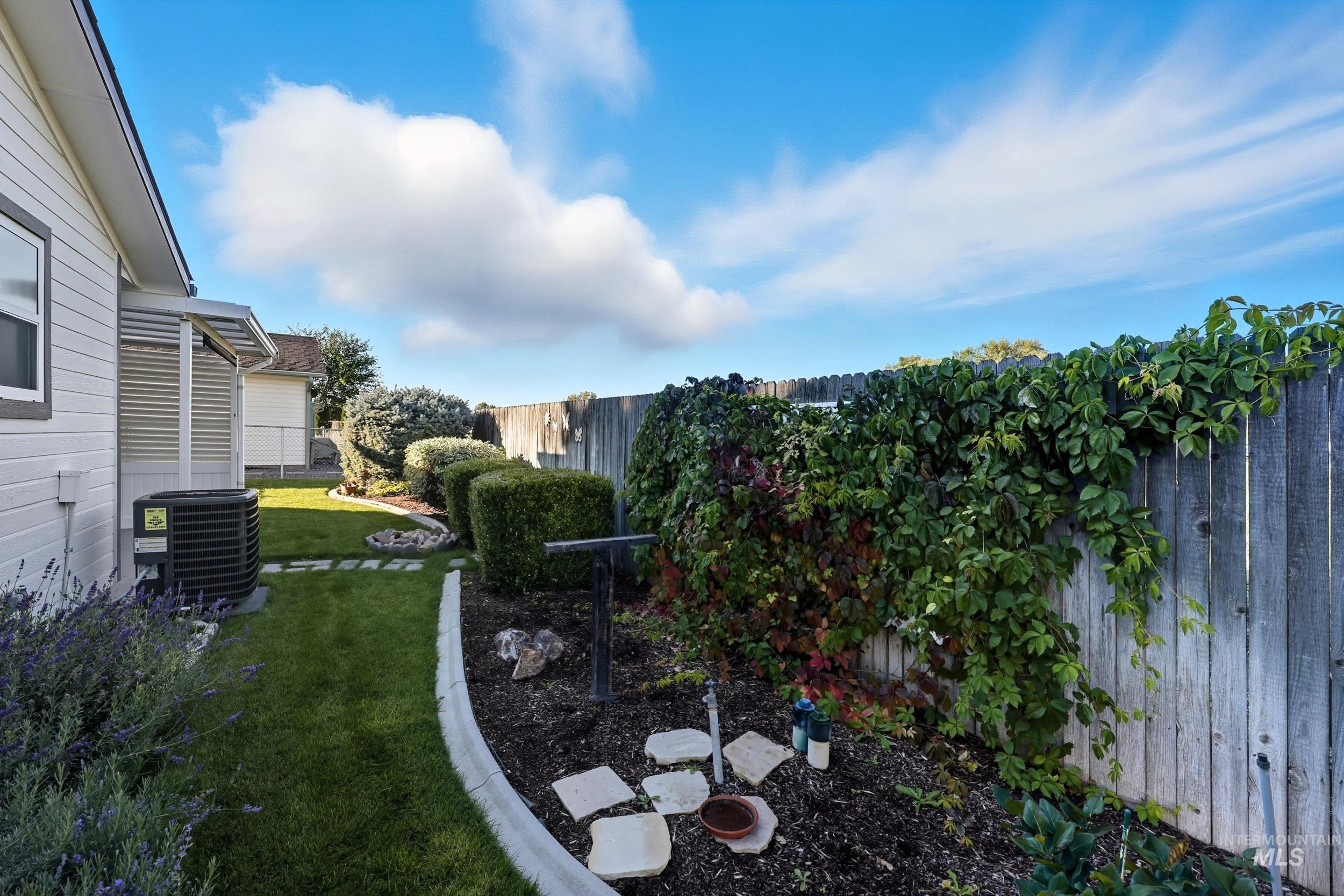 View of fenced backyard