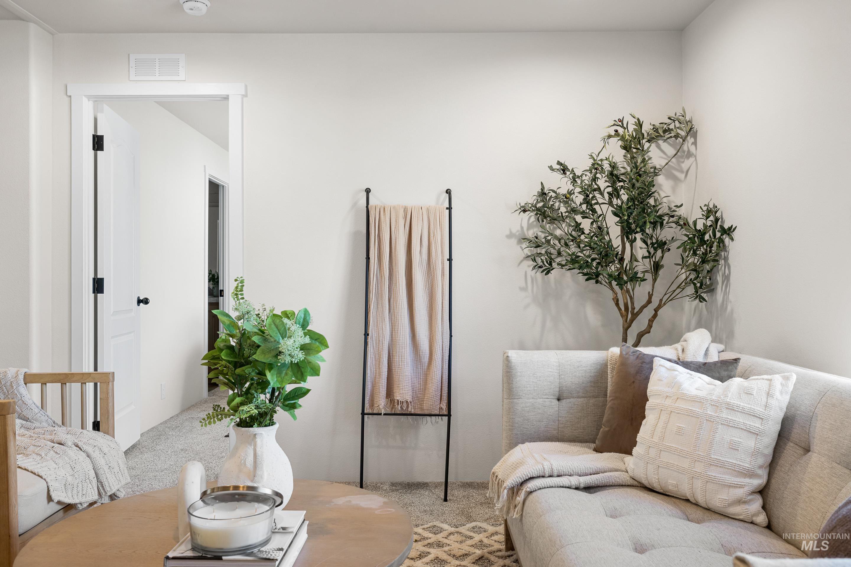 Living area featuring carpet flooring