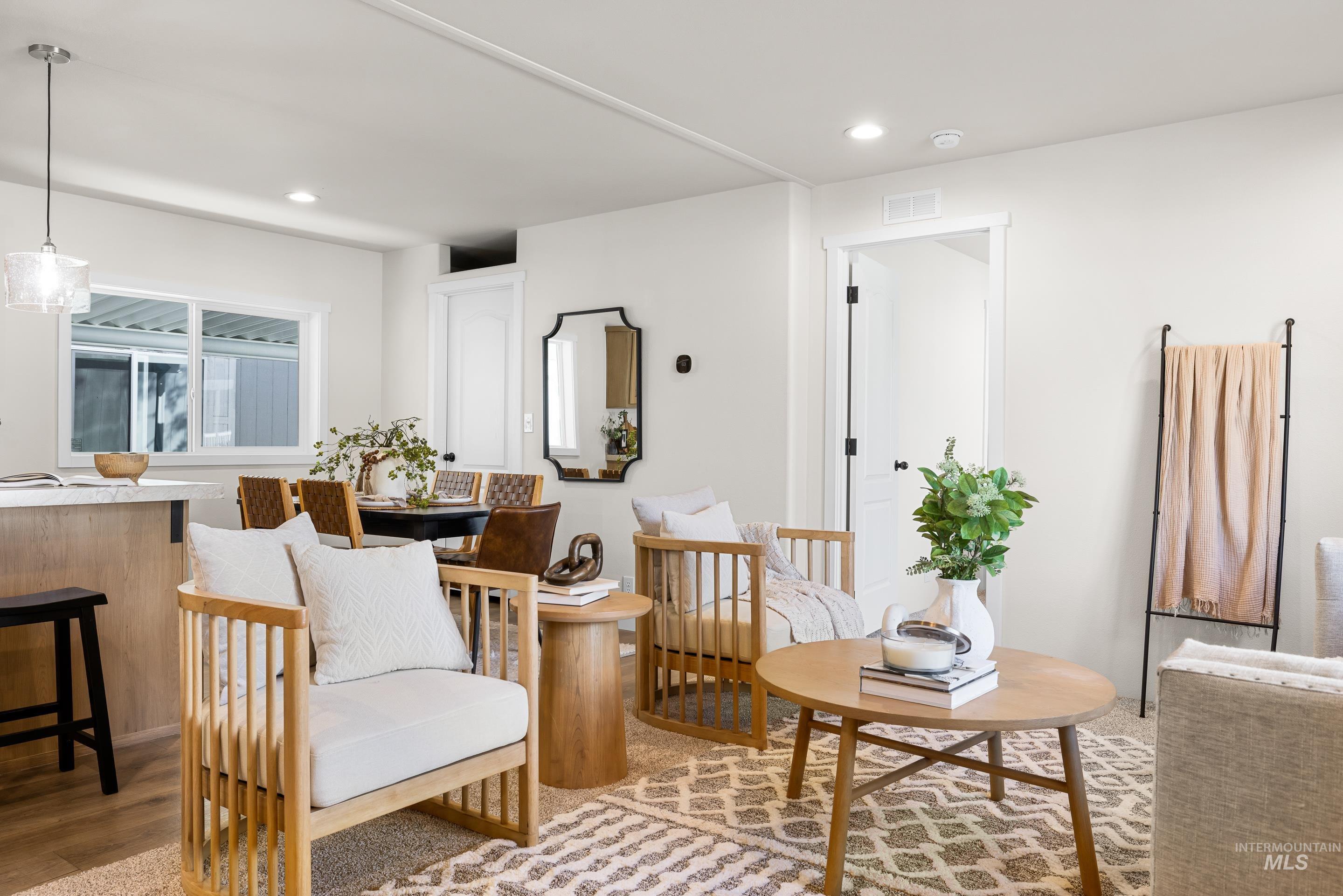 Living area featuring recessed lighting and light wood-style flooring