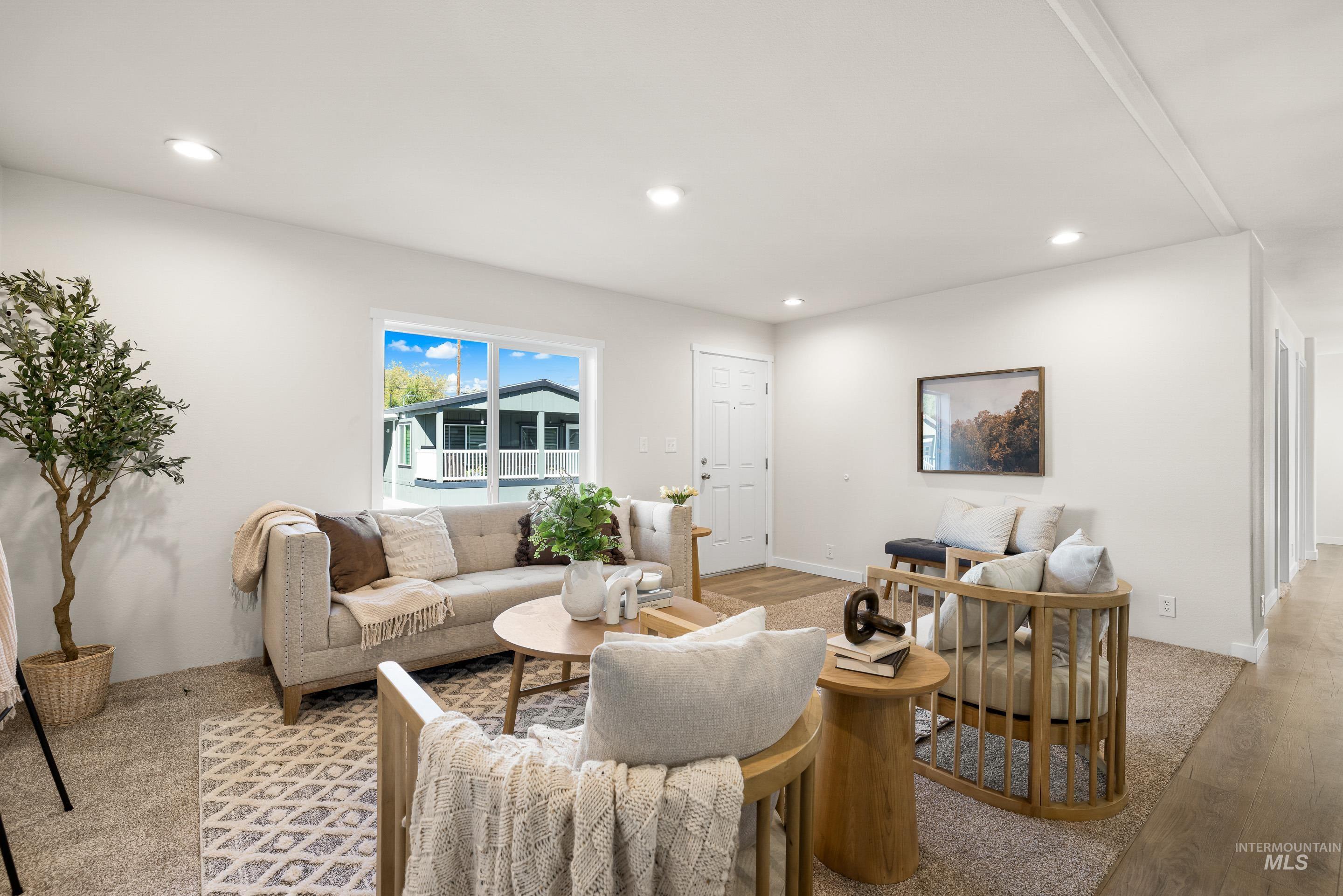 Living room featuring recessed lighting and light wood-style flooring
