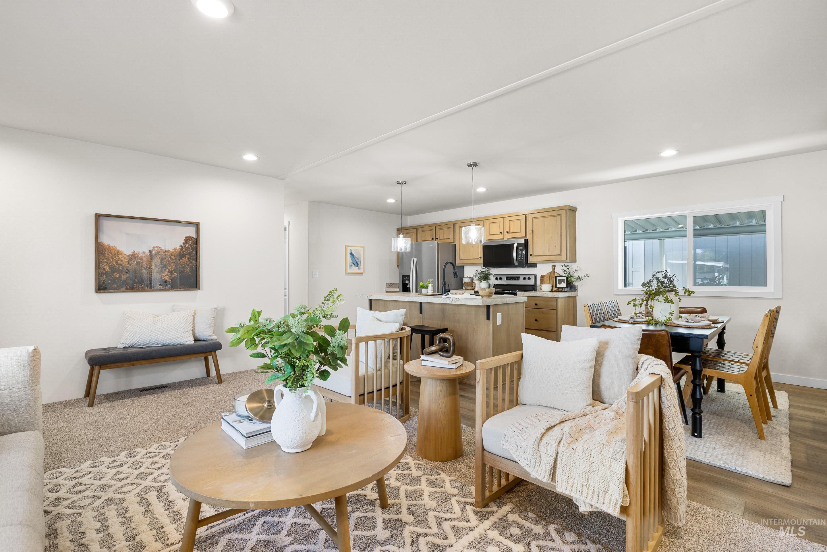 Living room with recessed lighting and light wood-style floors