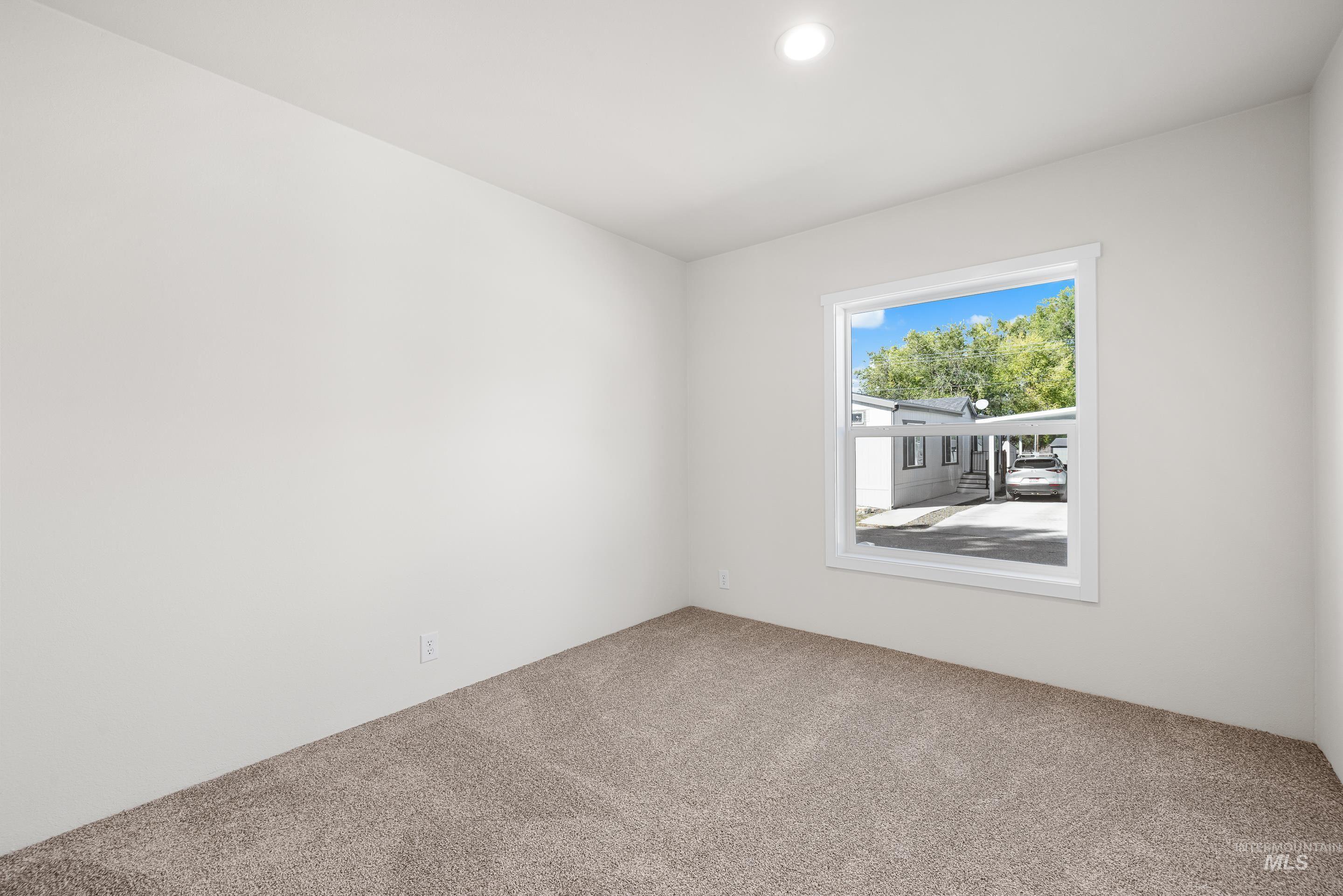 Unfurnished room featuring carpet and recessed lighting