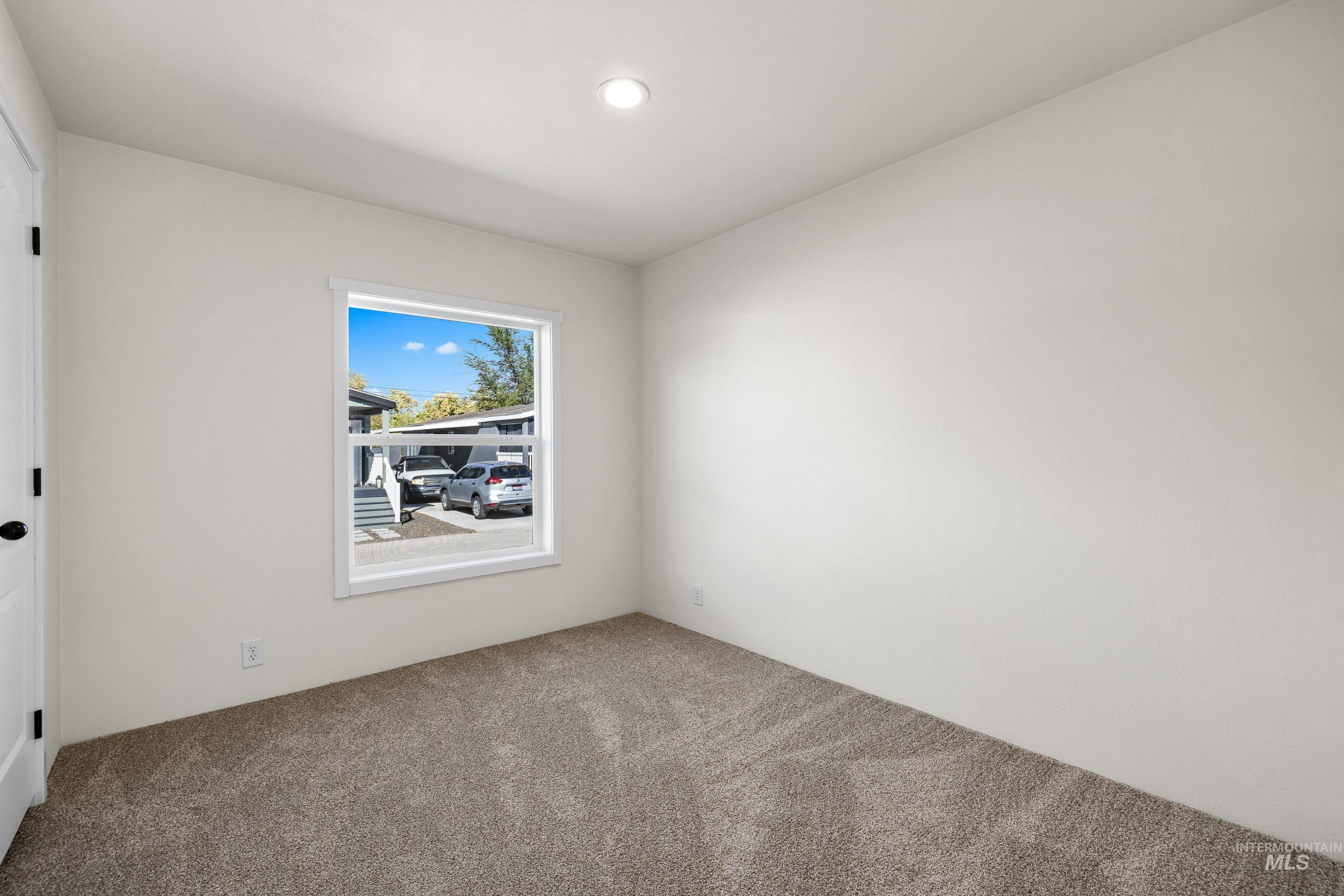 Unfurnished room with carpet and recessed lighting