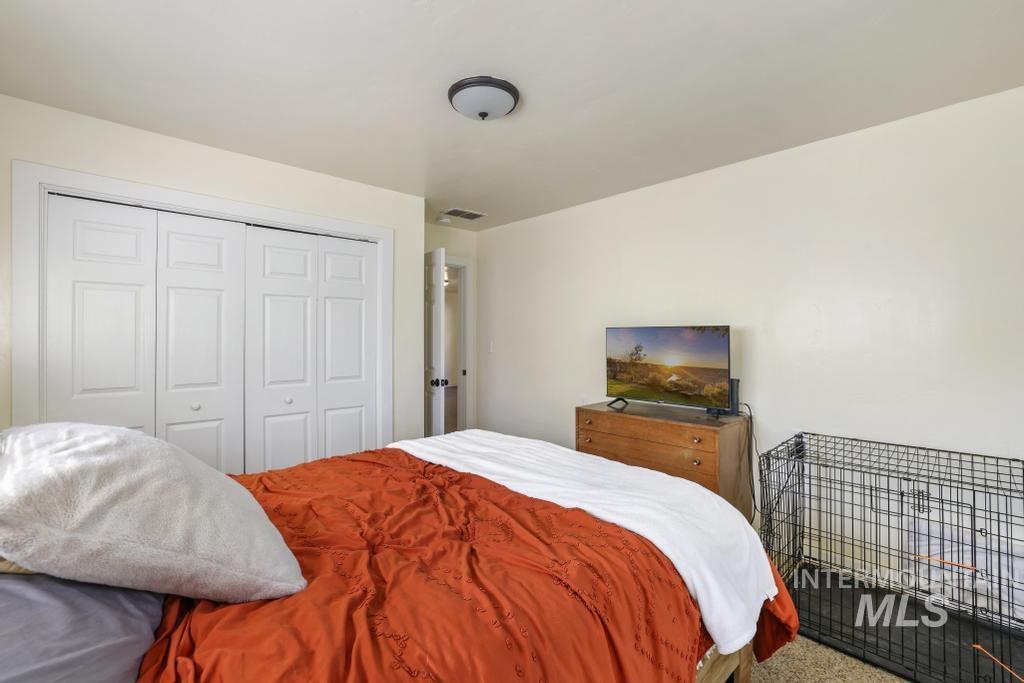 Bedroom featuring a closet and carpet