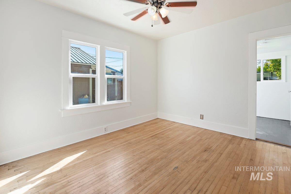 featuring light wood-style flooring and ceiling fan