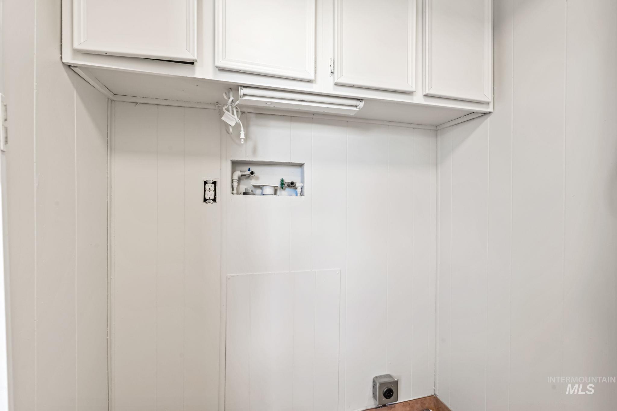 Laundry area with cabinet space