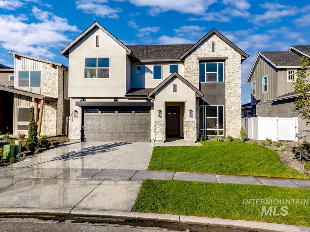 View of front facade featuring stone siding, stucco siding, concrete driveway, a garage, and a residential view