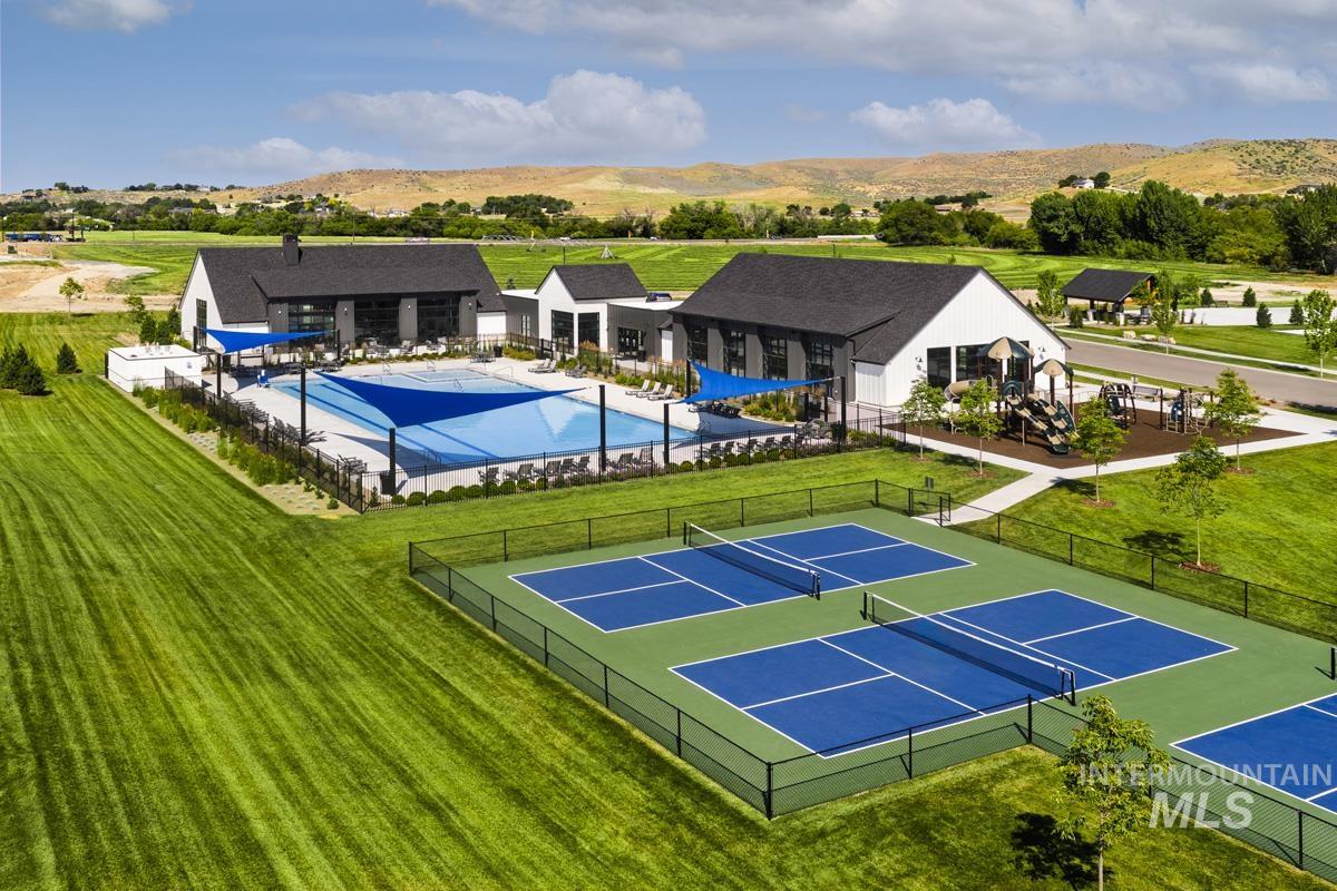 Aerial view of a pool area and a mountainous background