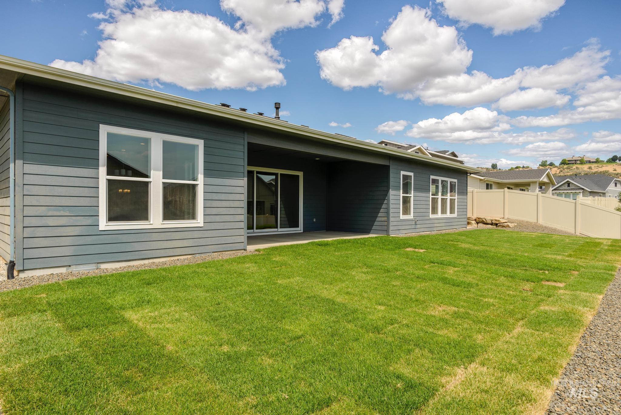 Rear view of house featuring a patio