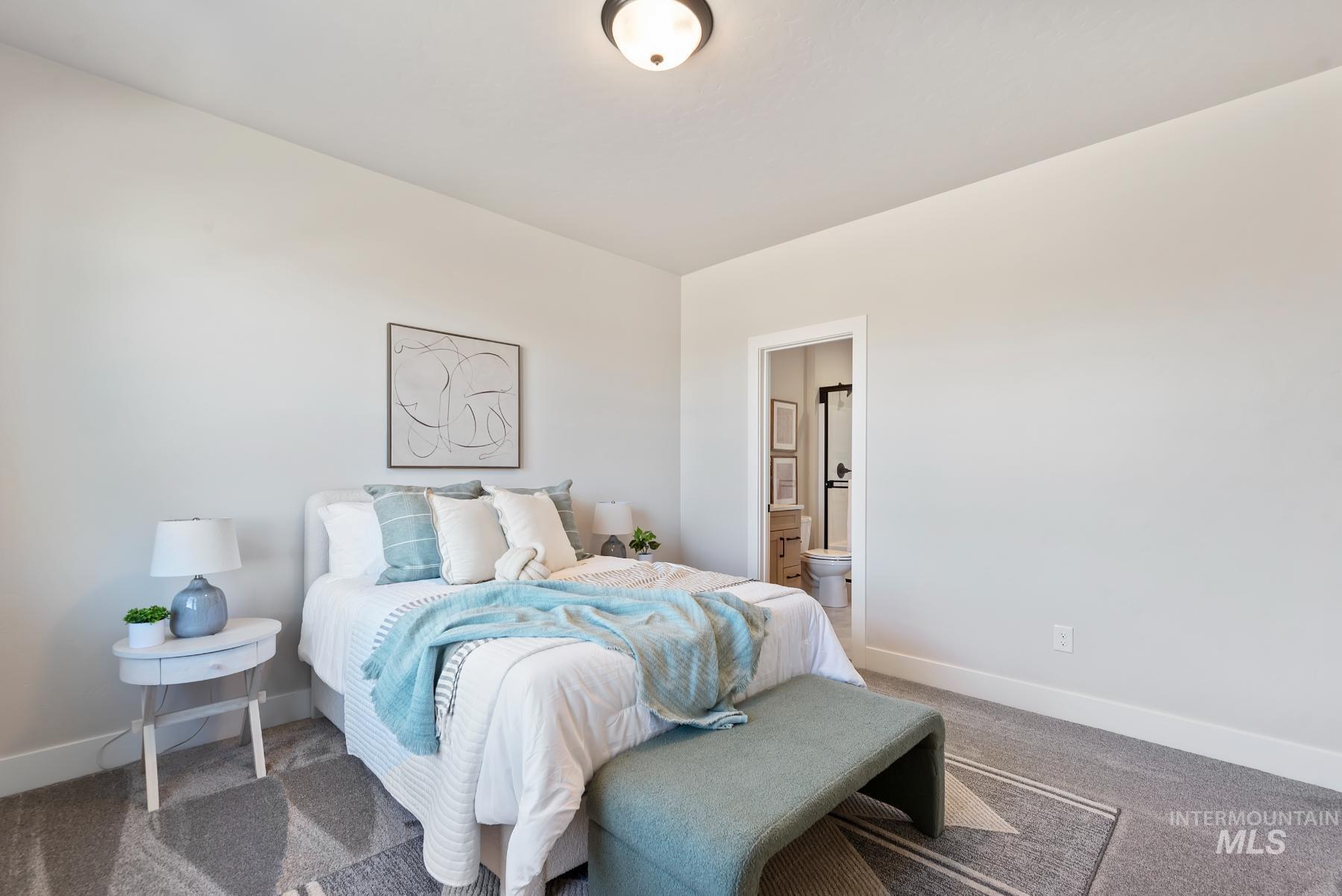 Bedroom with carpet and ensuite bathroom