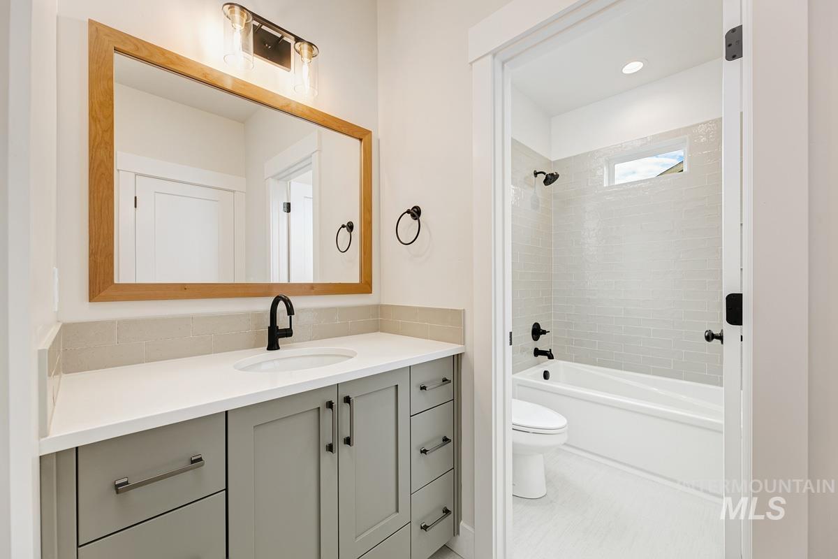 Full bathroom with vanity and tub / shower combination