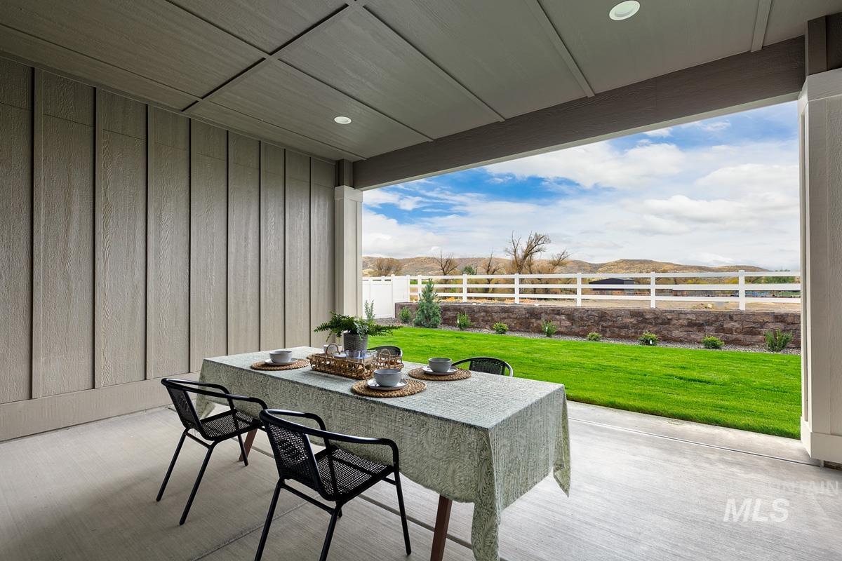 Fenced backyard with a patio area and outdoor dining space