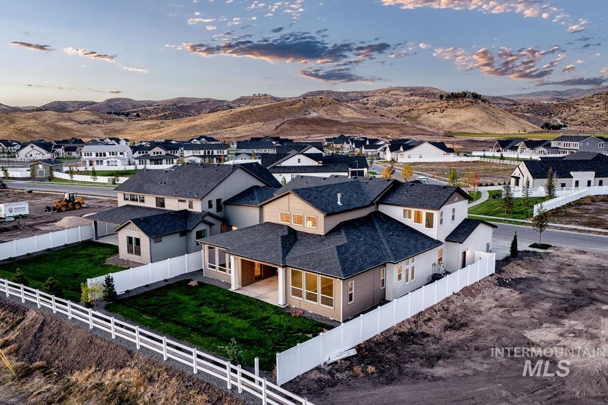 Aerial view at dusk of a residential view and a mountain view