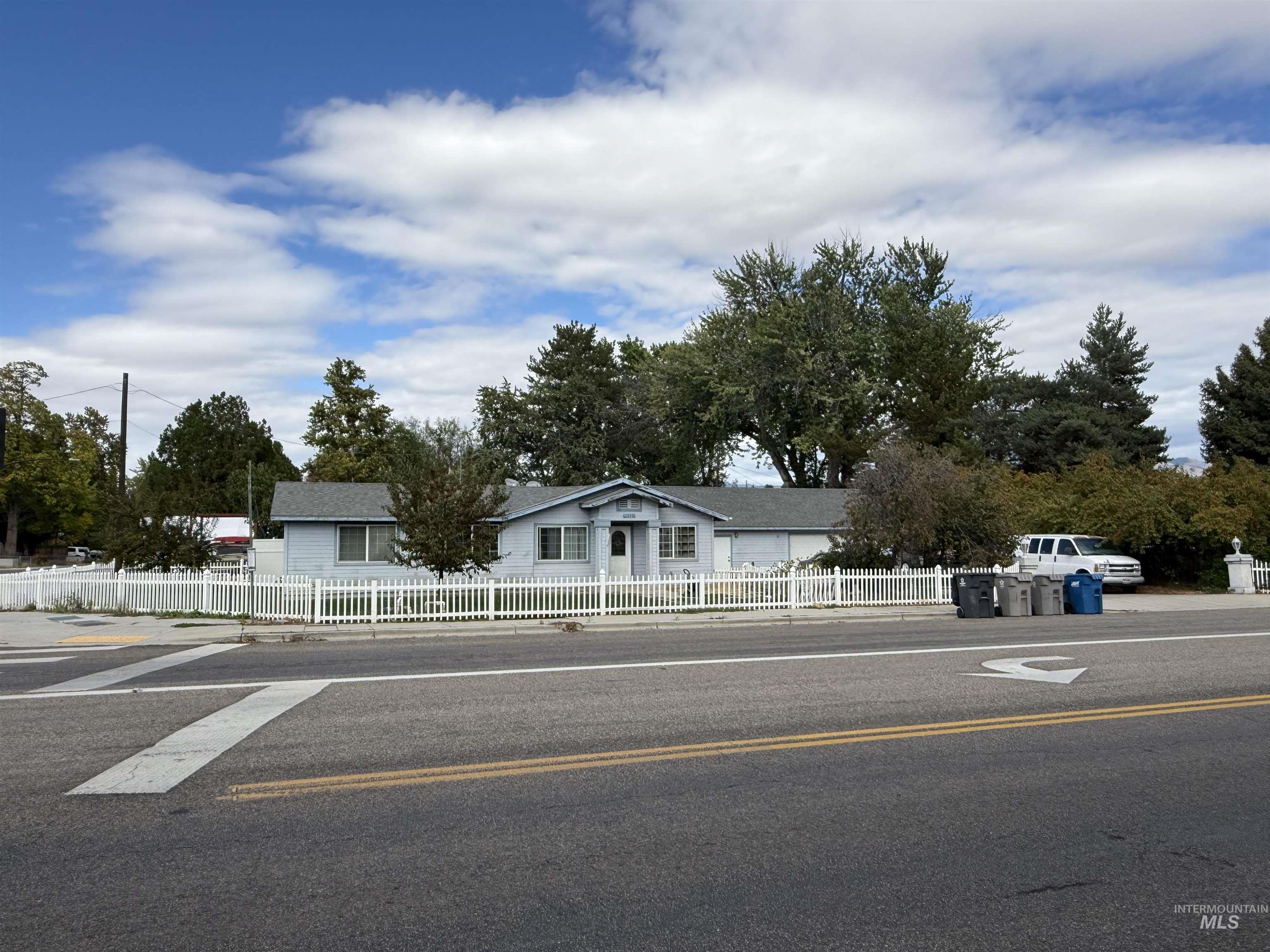 View of asphalt street with sidewalks and curbs