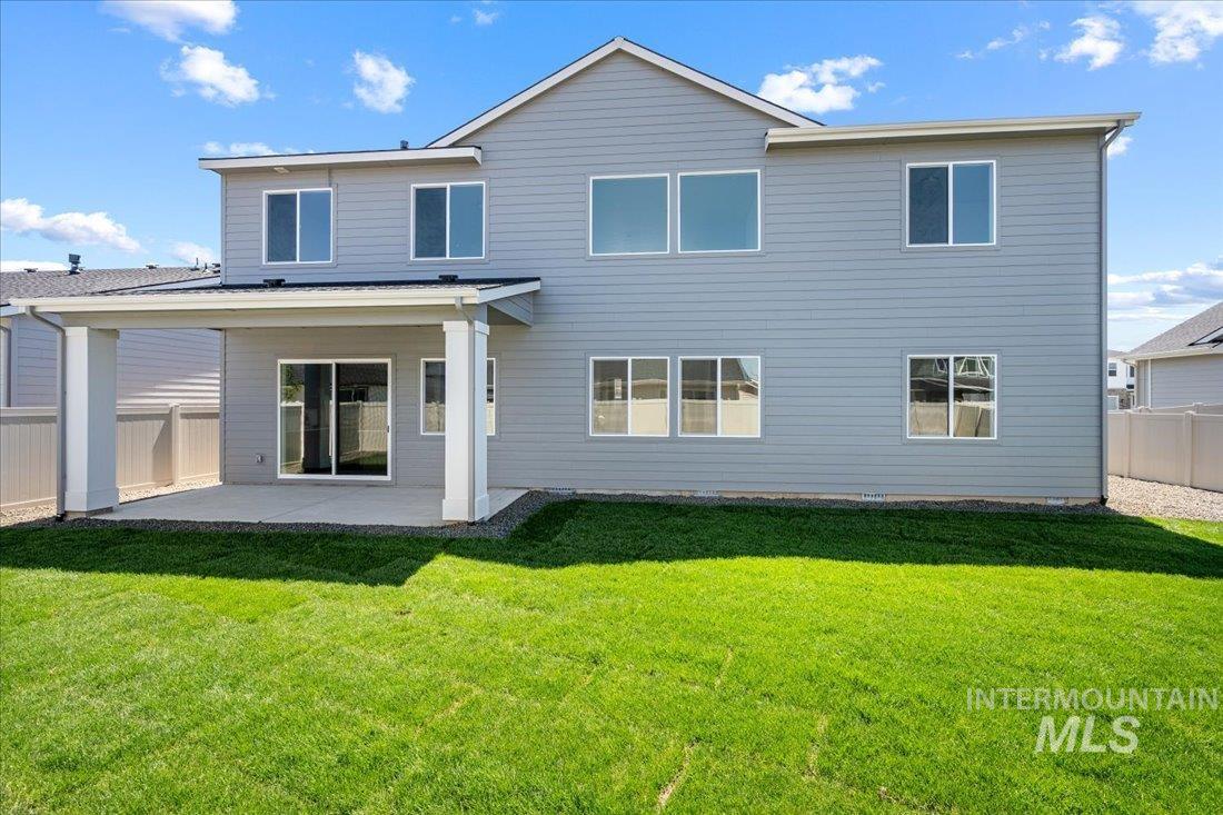Rear view of house with a patio