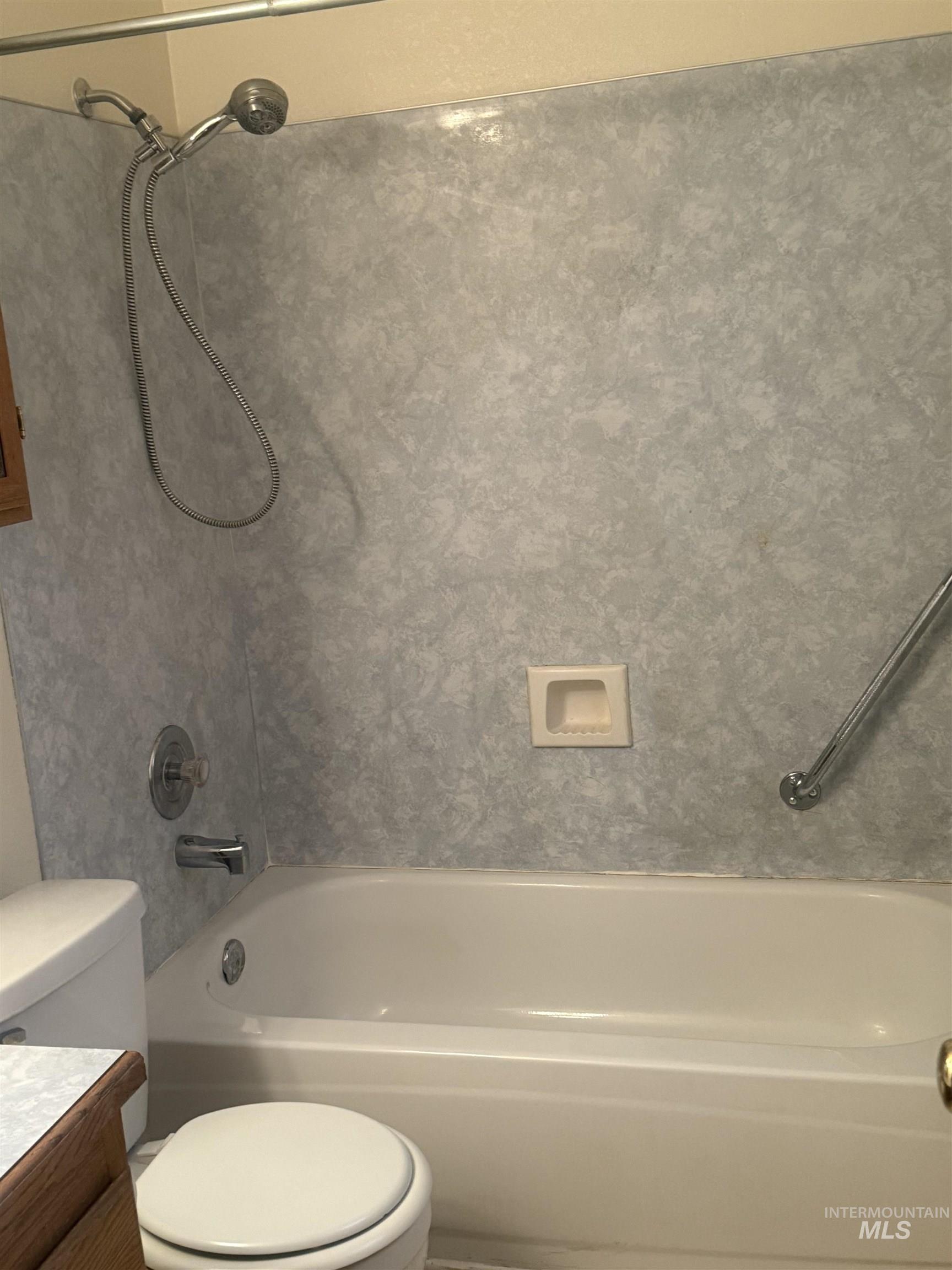 Full bathroom featuring washtub / shower combination and vanity