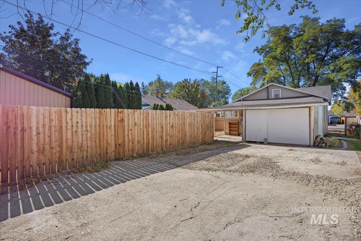 Garage featuring driveway