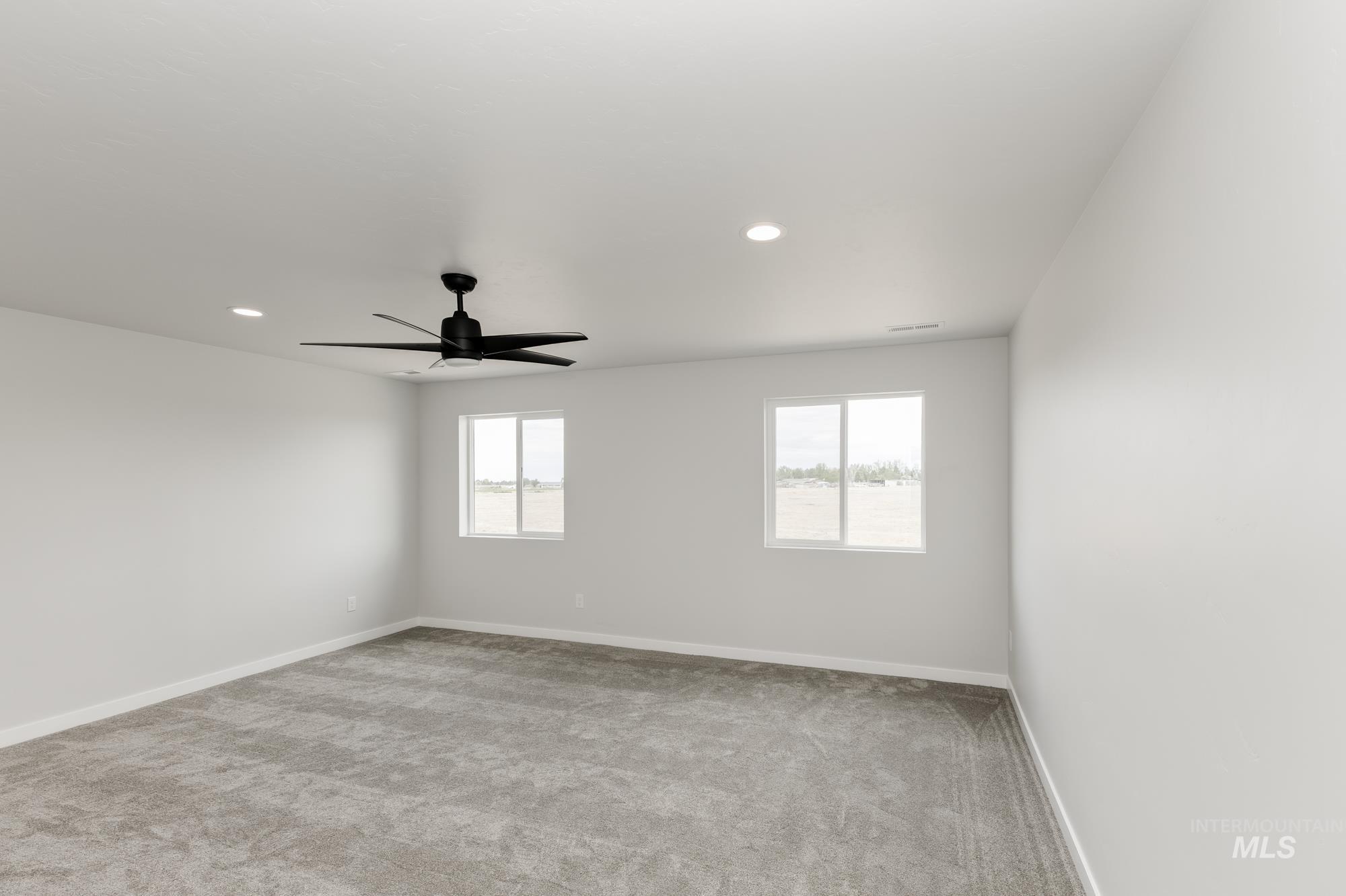 Unfurnished room with light colored carpet, recessed lighting, and a ceiling fan