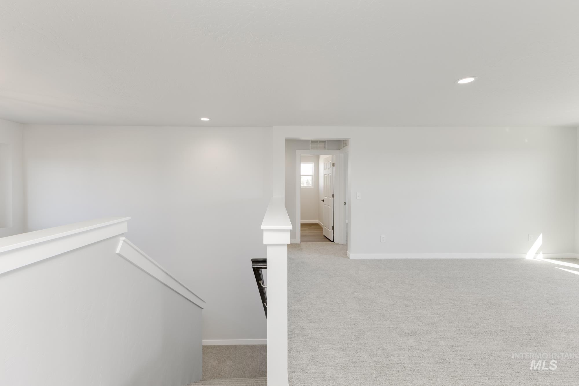 Stairs with attic access, carpet flooring, and recessed lighting