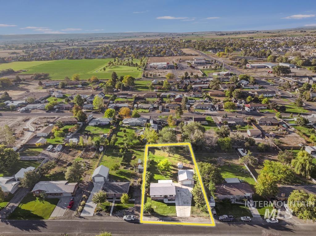 Aerial view of residential area with property parcel outlined