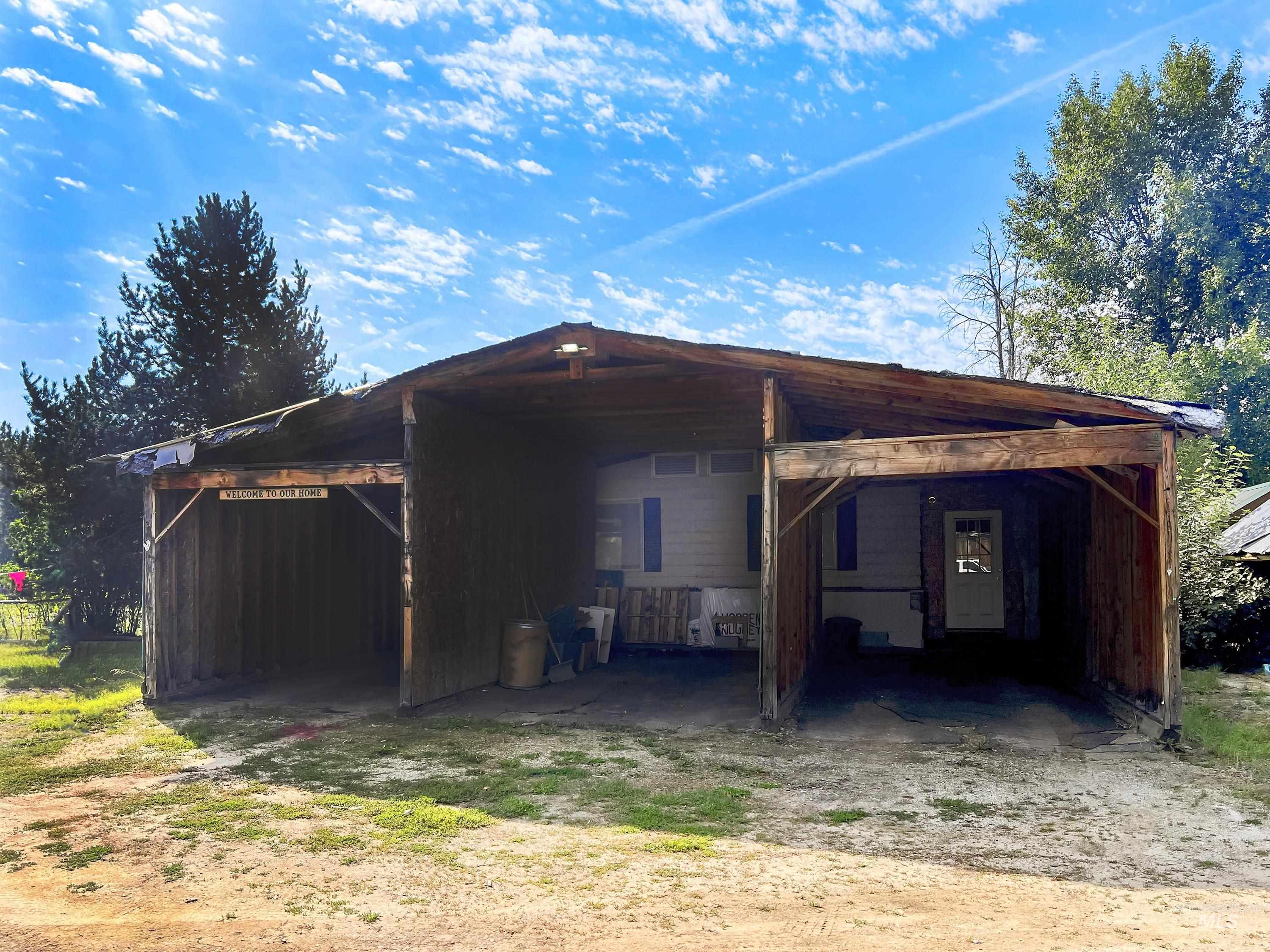 Garage featuring a carport