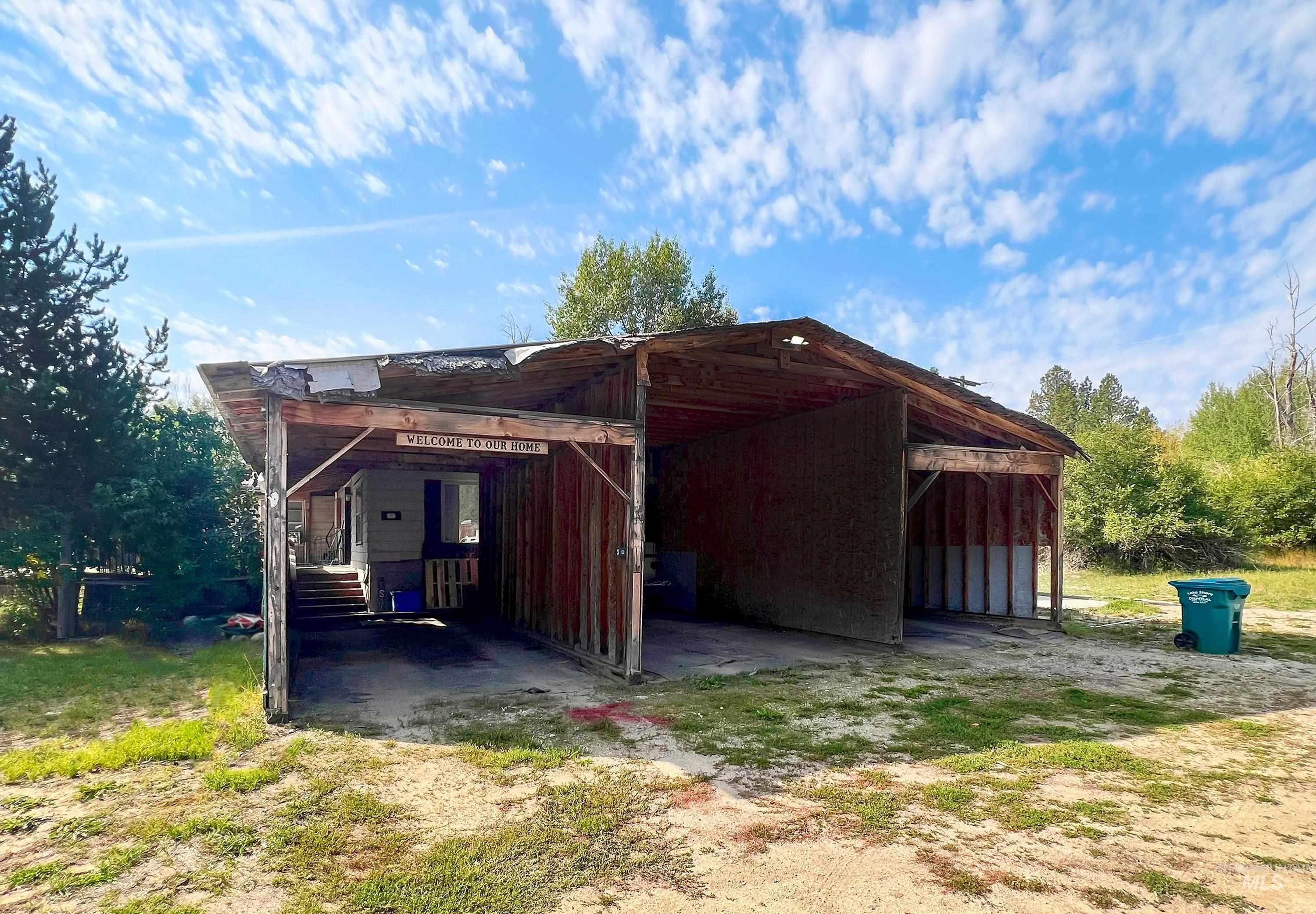 View of outbuilding with a carport