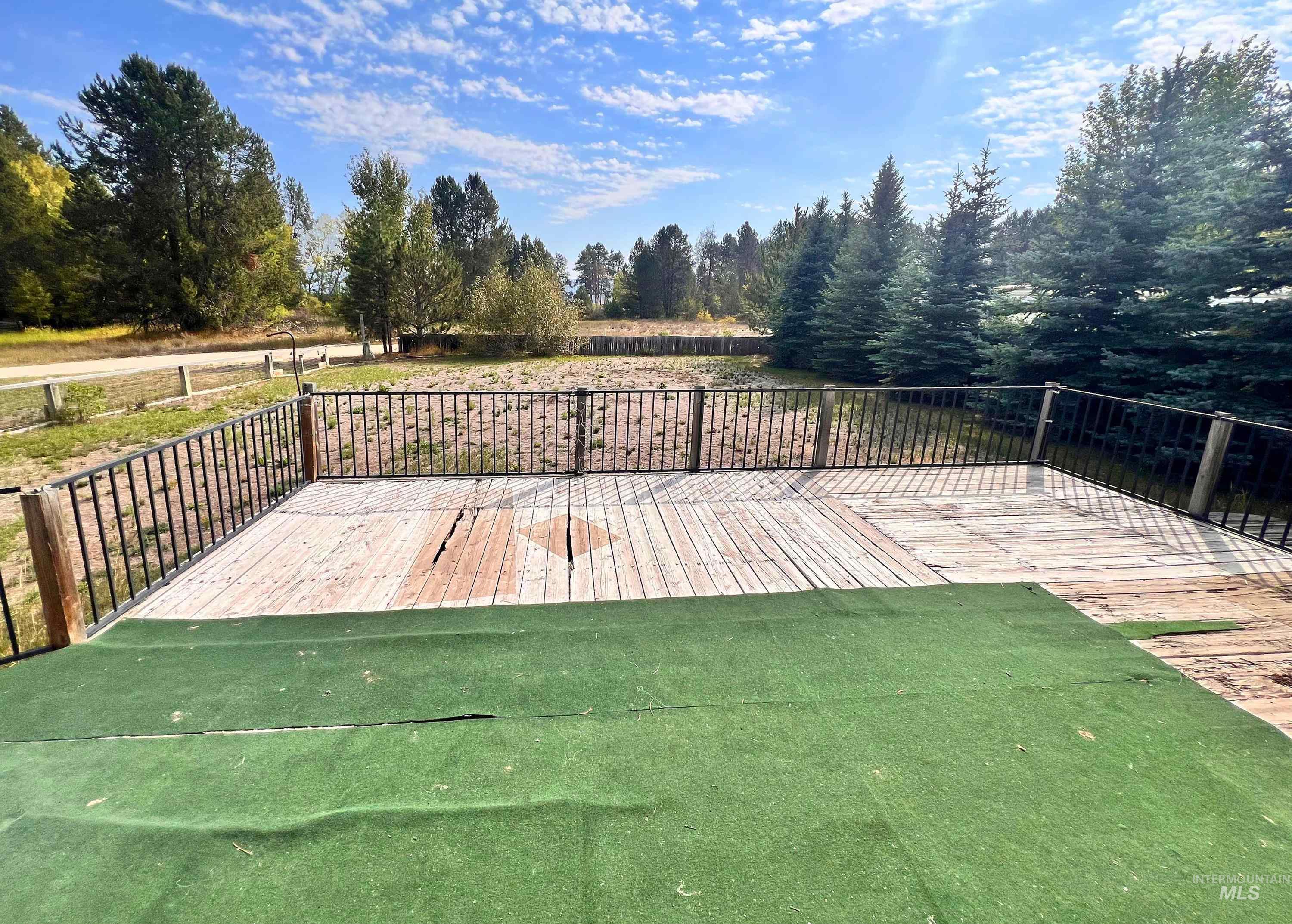 Wooden deck with a yard