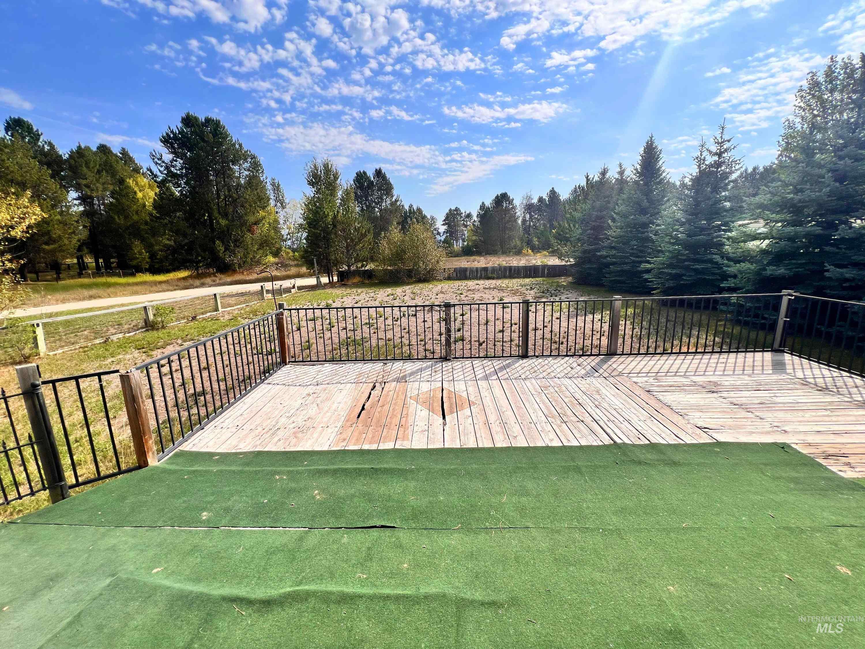 Deck featuring a lawn