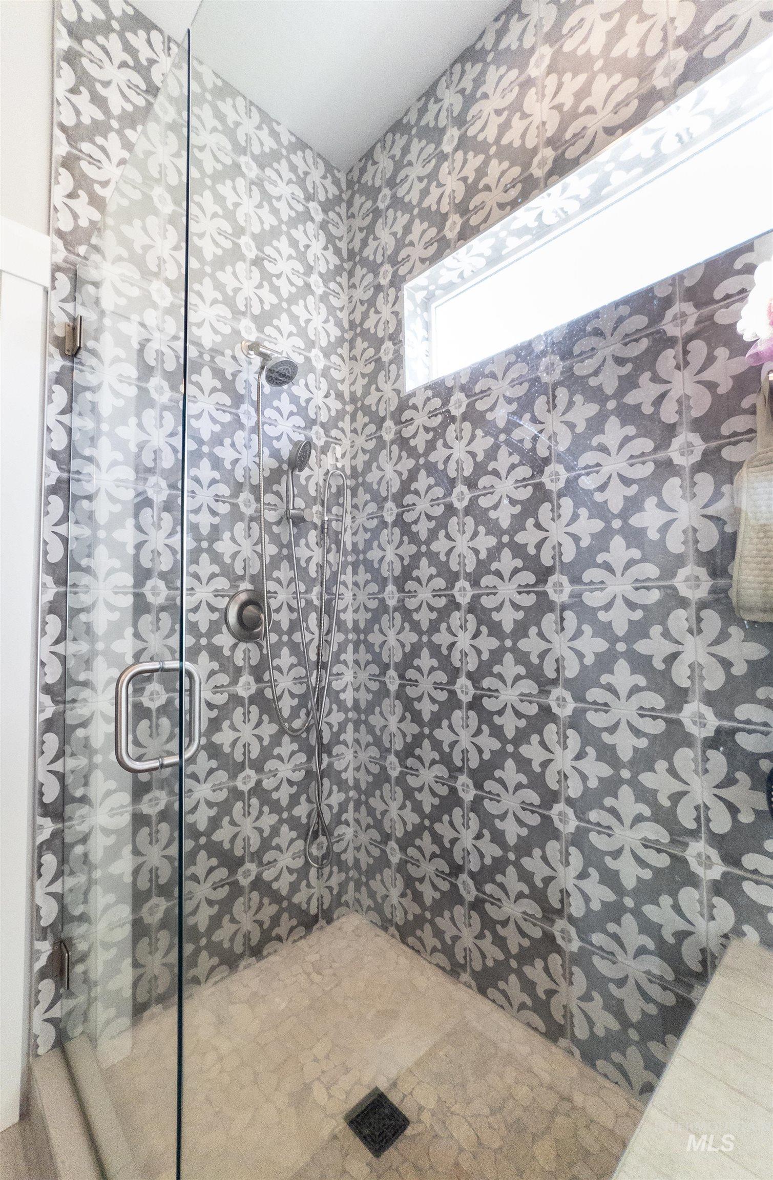 Full bathroom featuring a stall shower