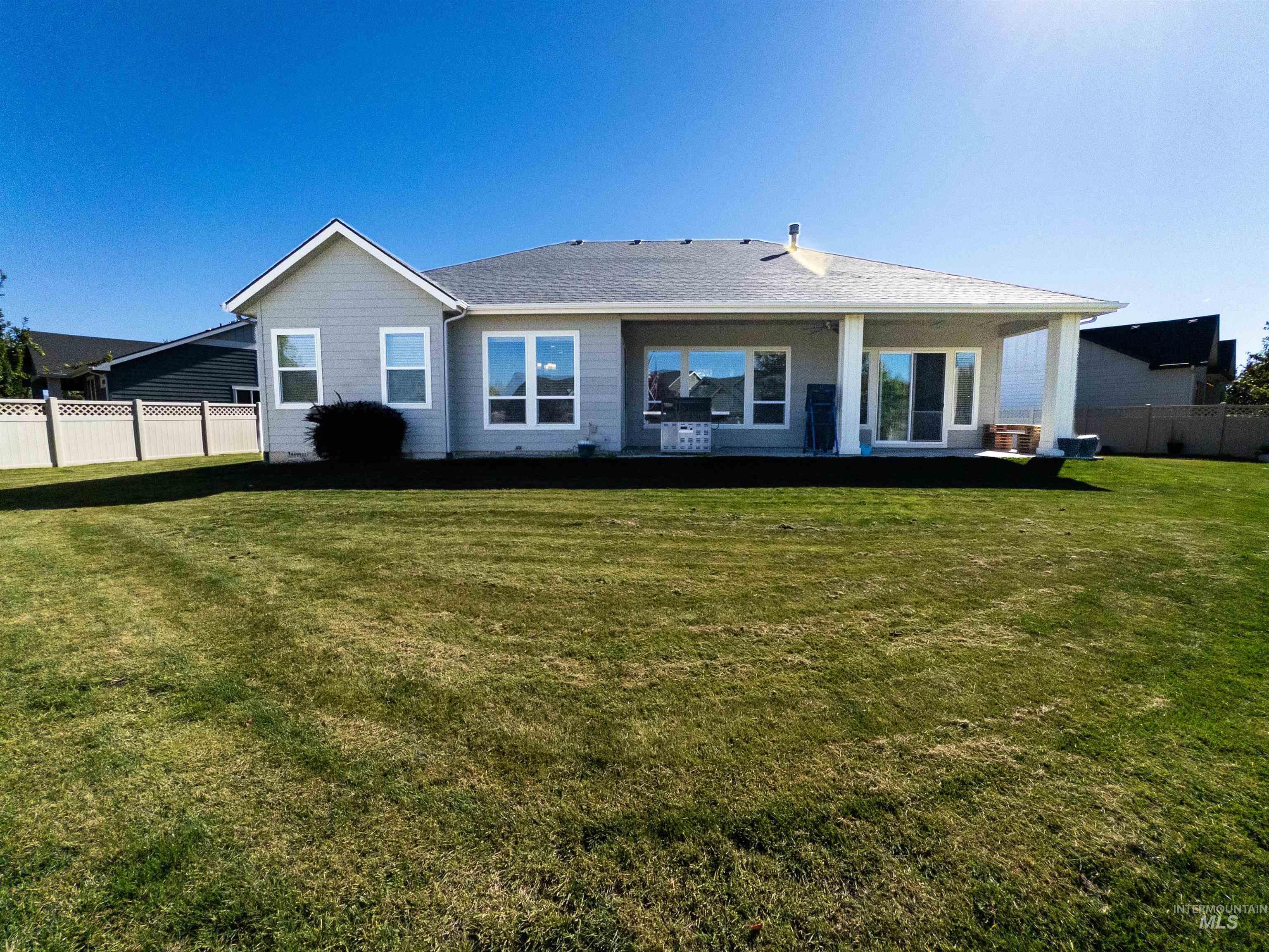 Rear view of house featuring a patio area