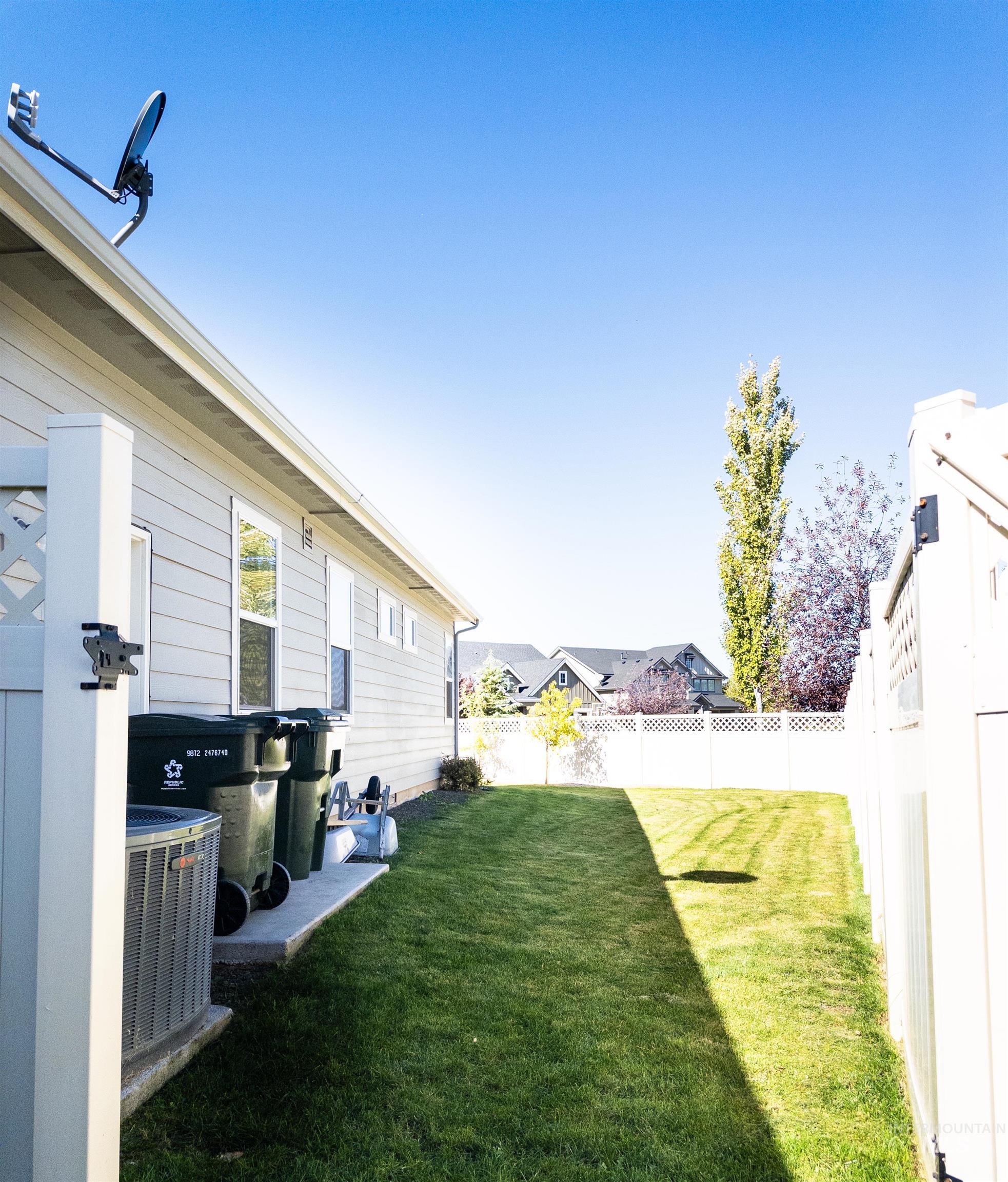 View of fenced backyard