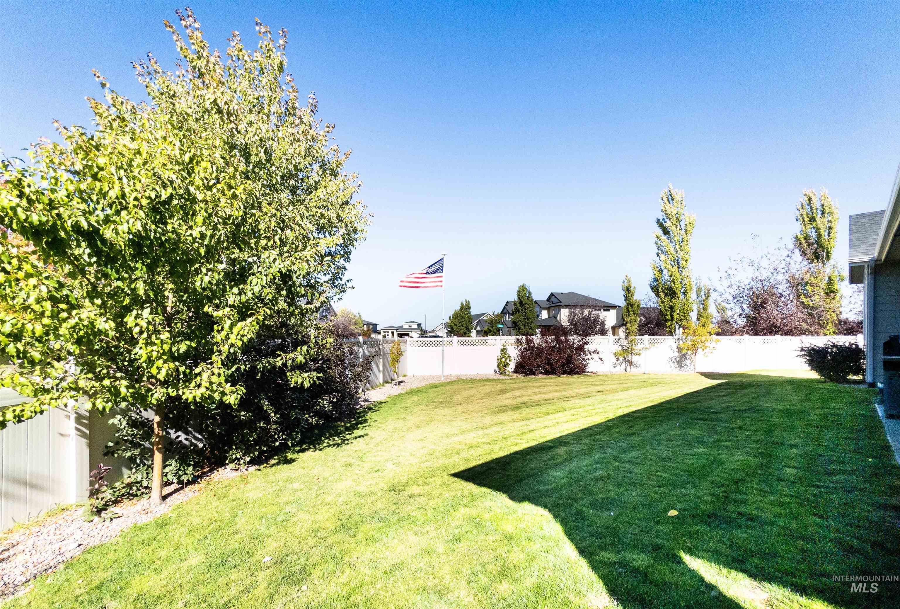 View of fenced backyard