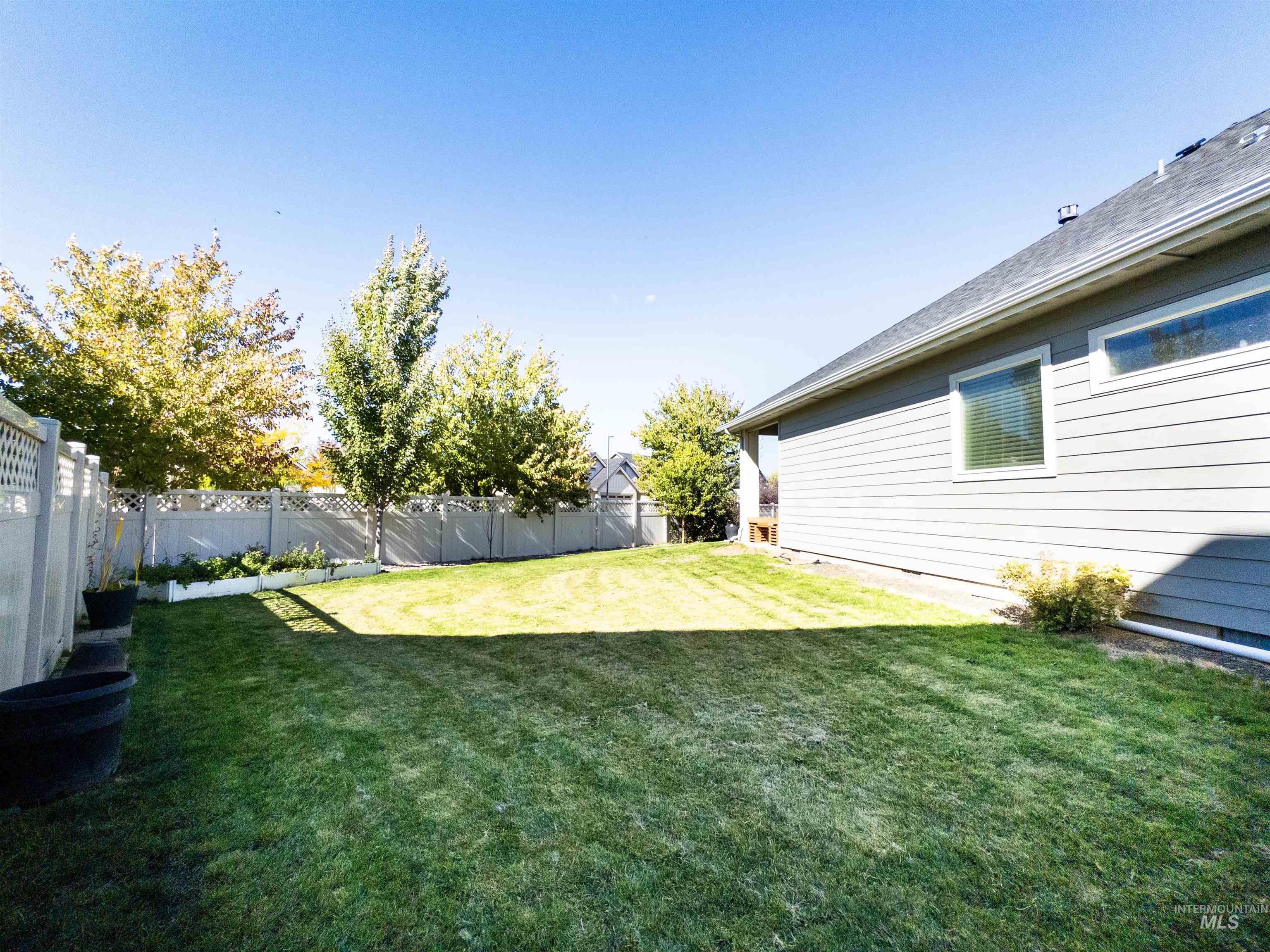 View of fenced backyard