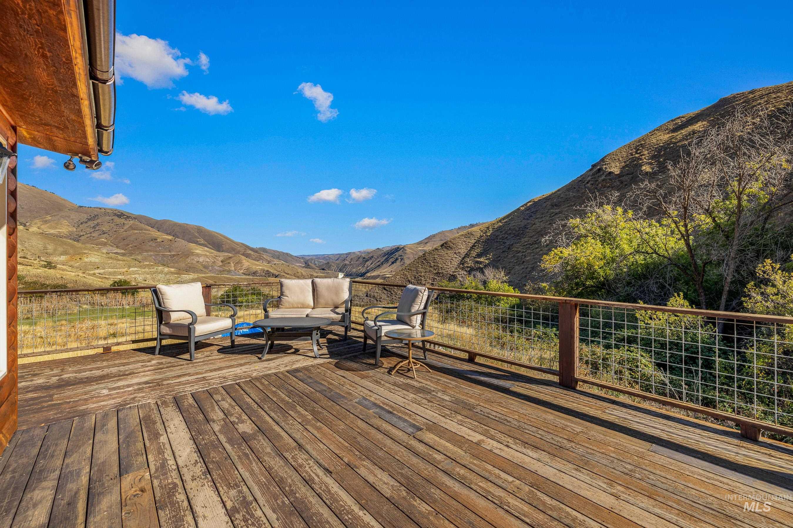 Deck with a mountain view and an outdoor hangout area