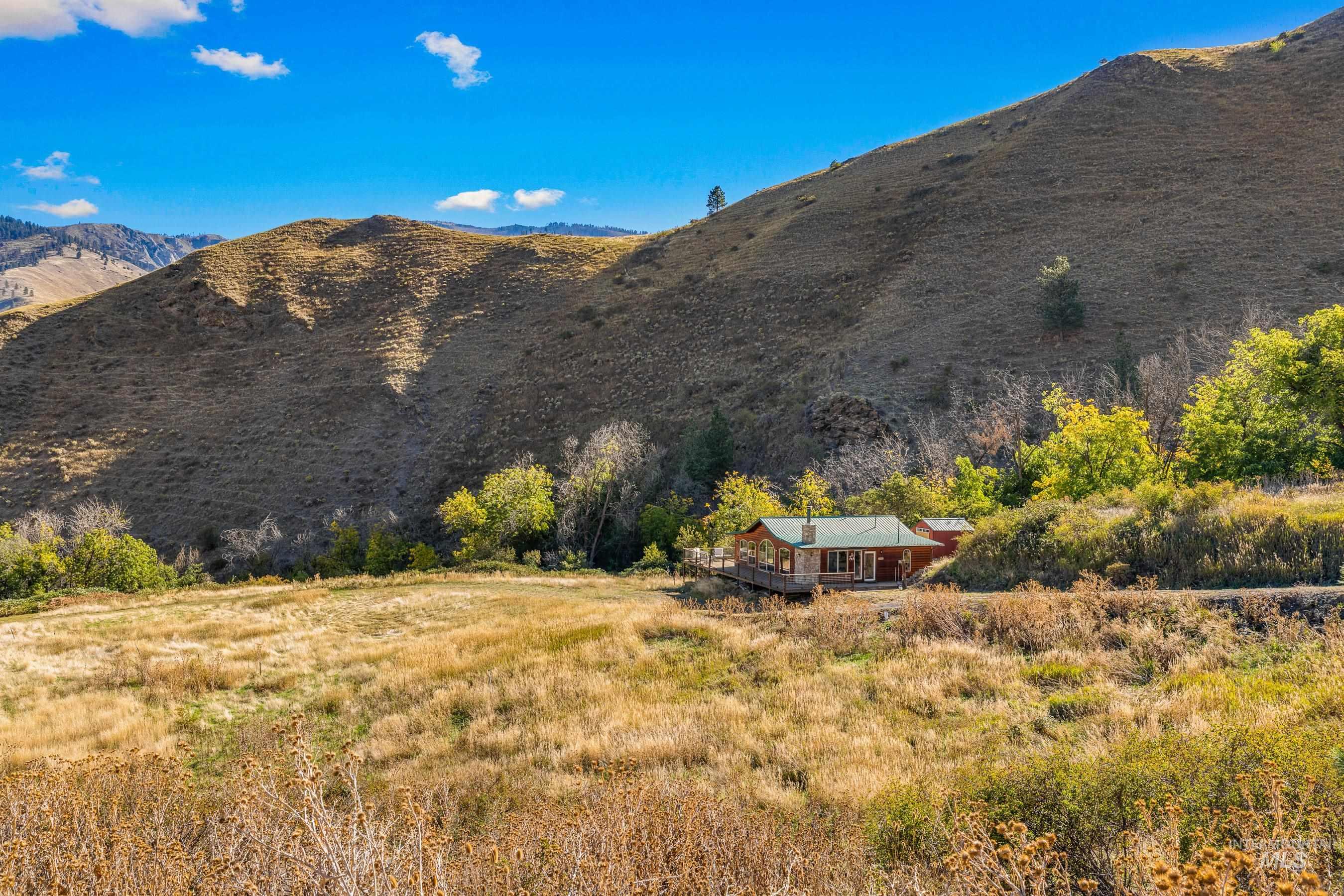 View of mountain backdrop with rural landscape