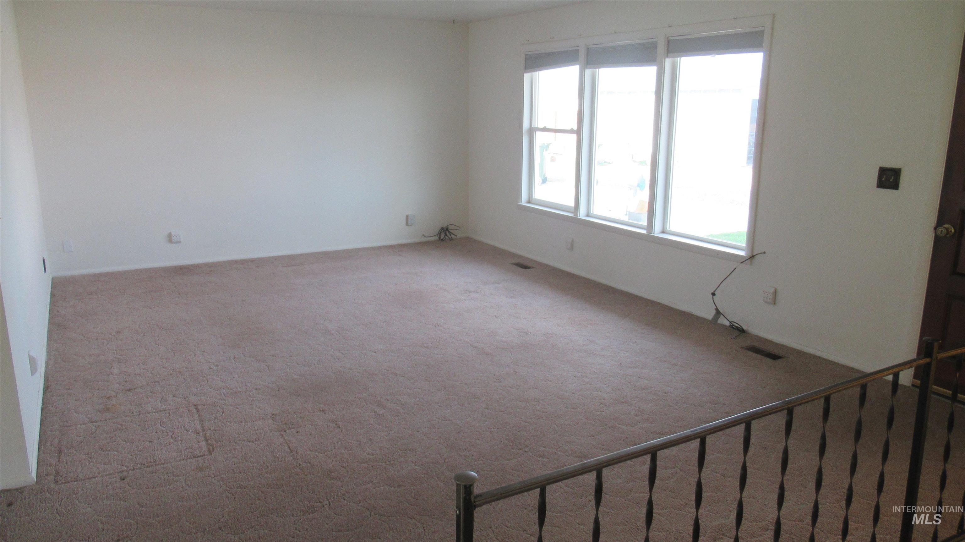 Unfurnished room featuring carpet floors
