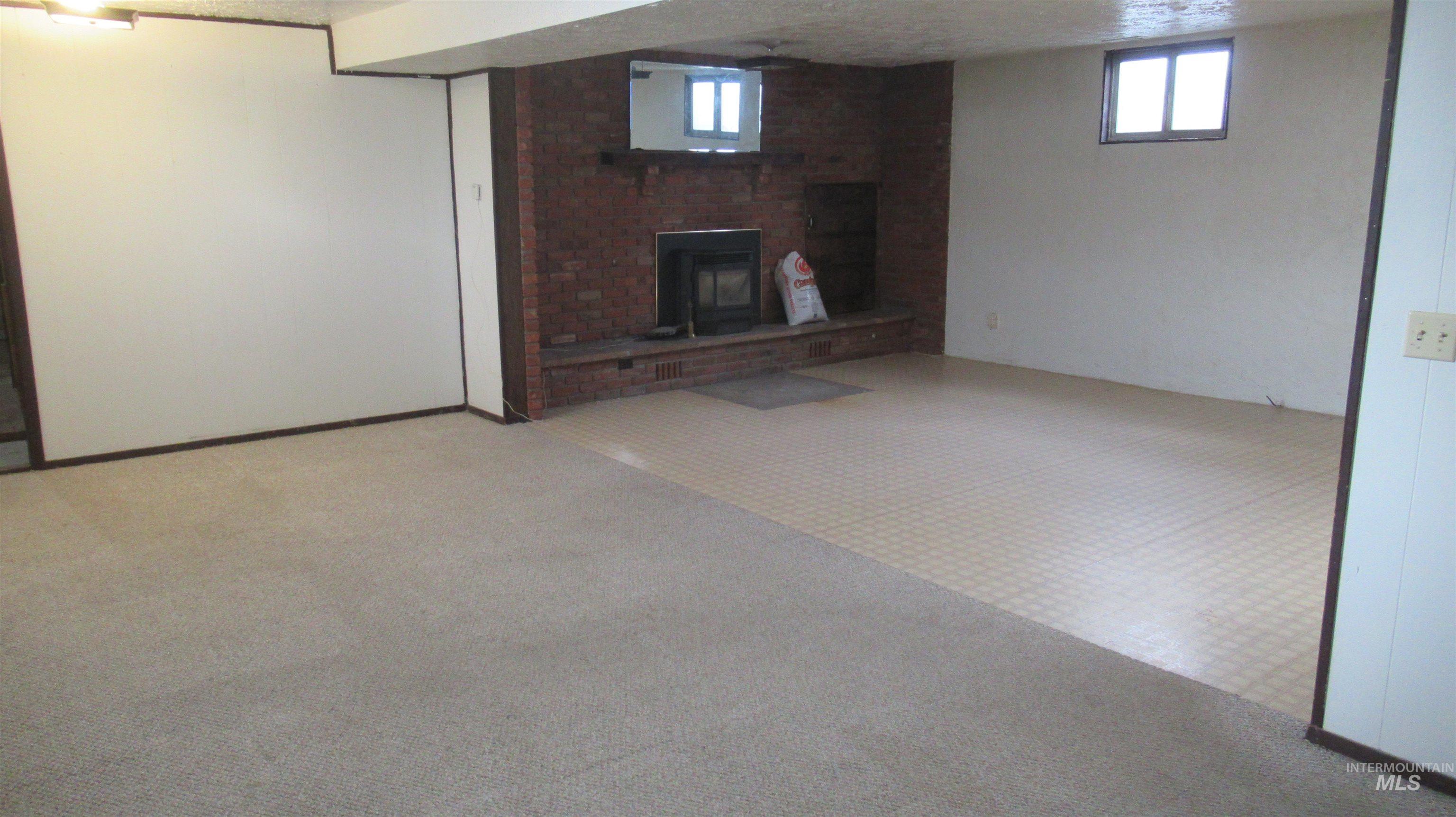 Basement featuring a fireplace and a textured ceiling