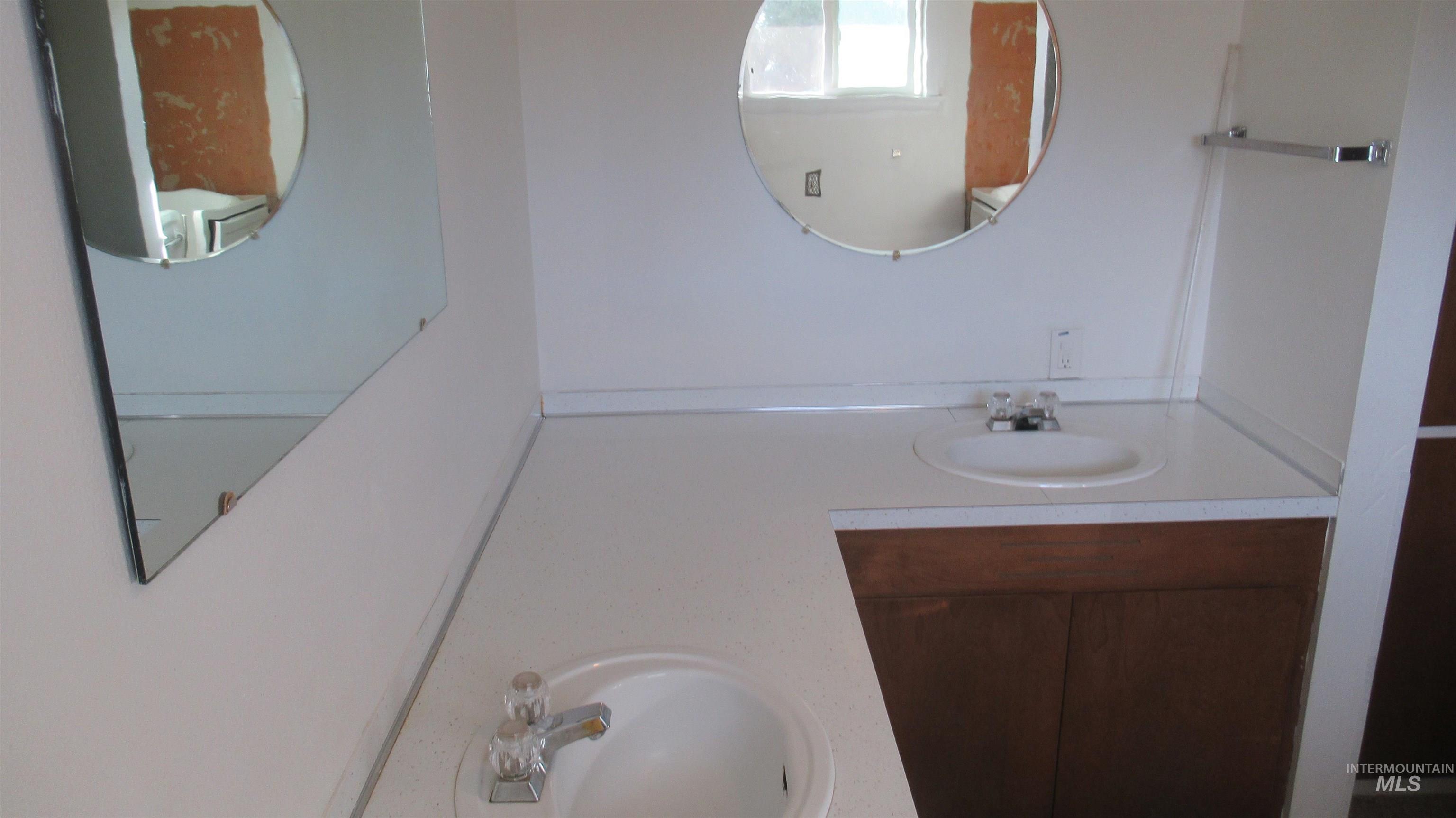Bathroom featuring double vanity